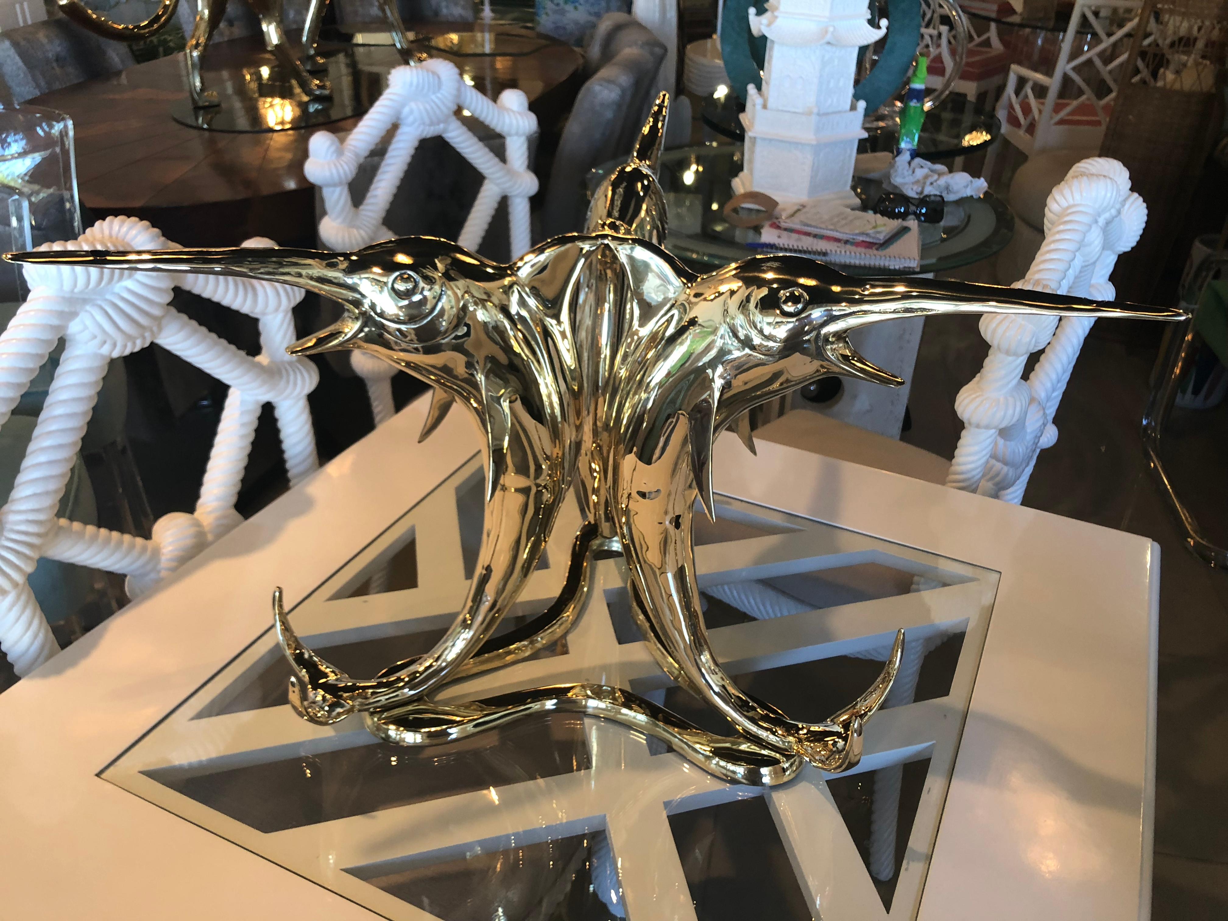 This is an amazing, unique coffee cocktail table. Professionally polished brass Marlin Fish (3). Glass top not included. Great nautical, coastal, Palm Beach piece. 

 