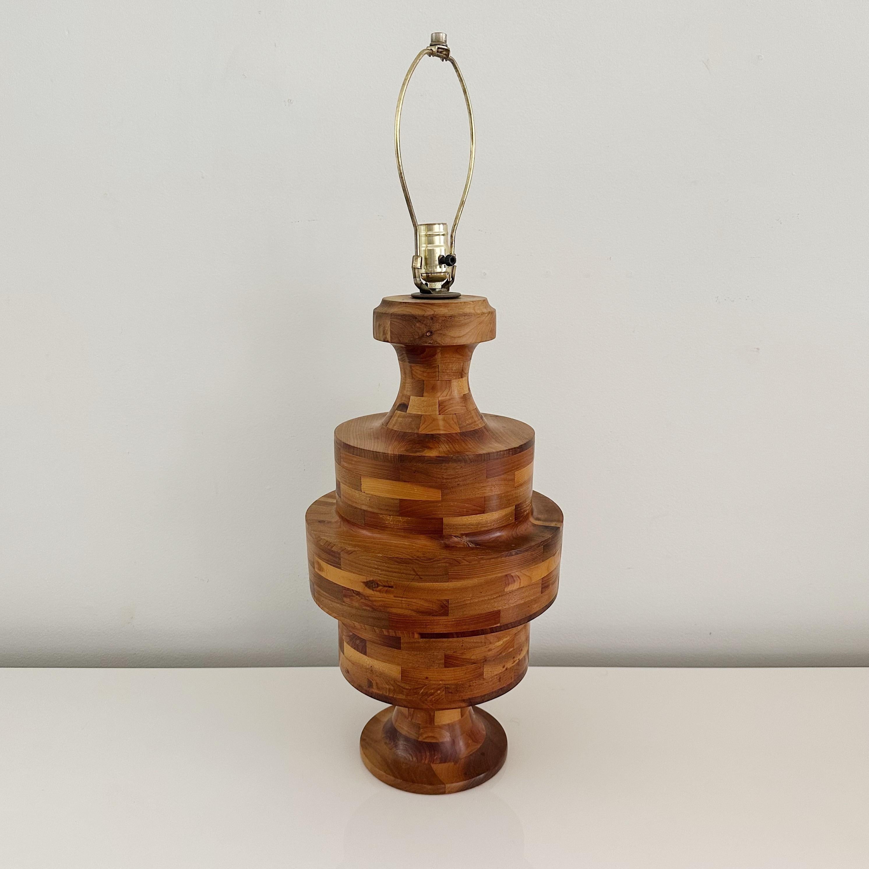 Vintage Marquetry Hand-Turned Lathe Block Lamp, Crafted from Various Woods from the 1970s with a Striking Stacked Wood Color Pattern

Handcrafted marquetry lamp, expertly created from a stunning selection of different wood types. Crafted using