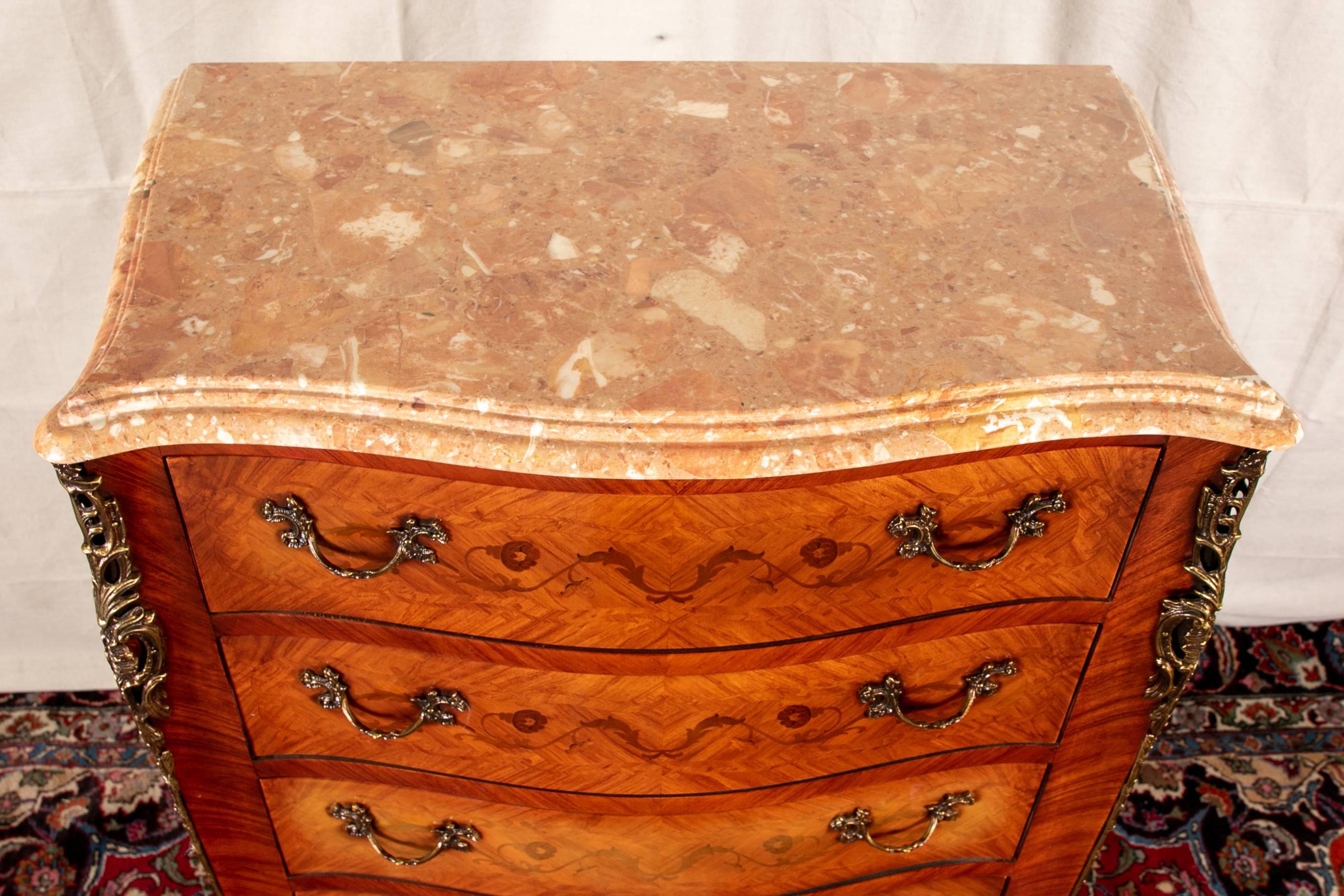 Vintage marquetry semanier with marble-top and decorative mounts, seven drawers, tiered marble top, scrolling floral vines, and short cabriole legs.

Condition: 3/4