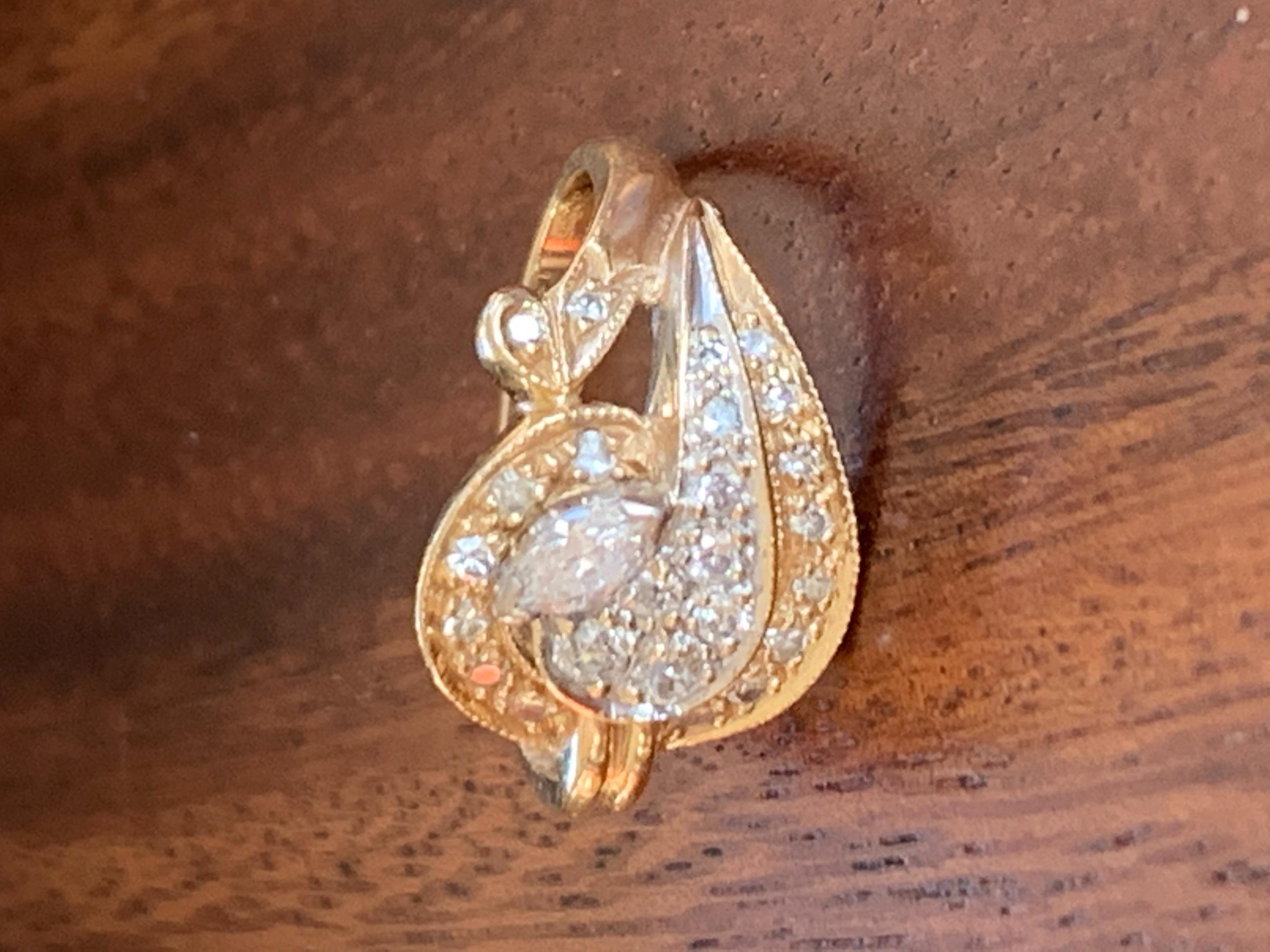 This beautiful Diamond ring features one 5x3mm marquise cut Diamond, which is surrounded by a swirl of Gold which is accented by 24 single cut brilliant cute Diamonds. The total weight is .5ctw.  Average grades are SI(I)-G.

Size: 5 1/2
Weight: 4.97