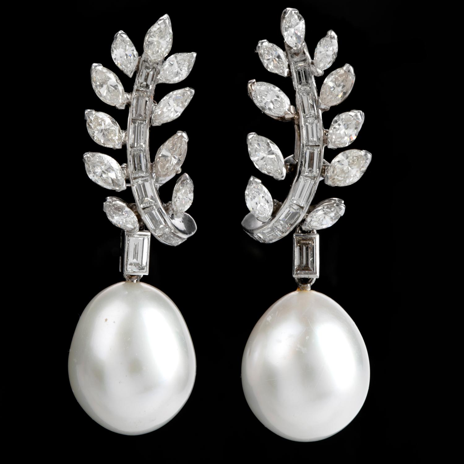 These alluring vintage drop earrings are crafted in solid platinum, weighing approx. 20.4 grams.

These earrings expose a pair of 16 mm south sea pearls, of white with pinkish-cream hue' color, attached dangle from baguette and marquise shape