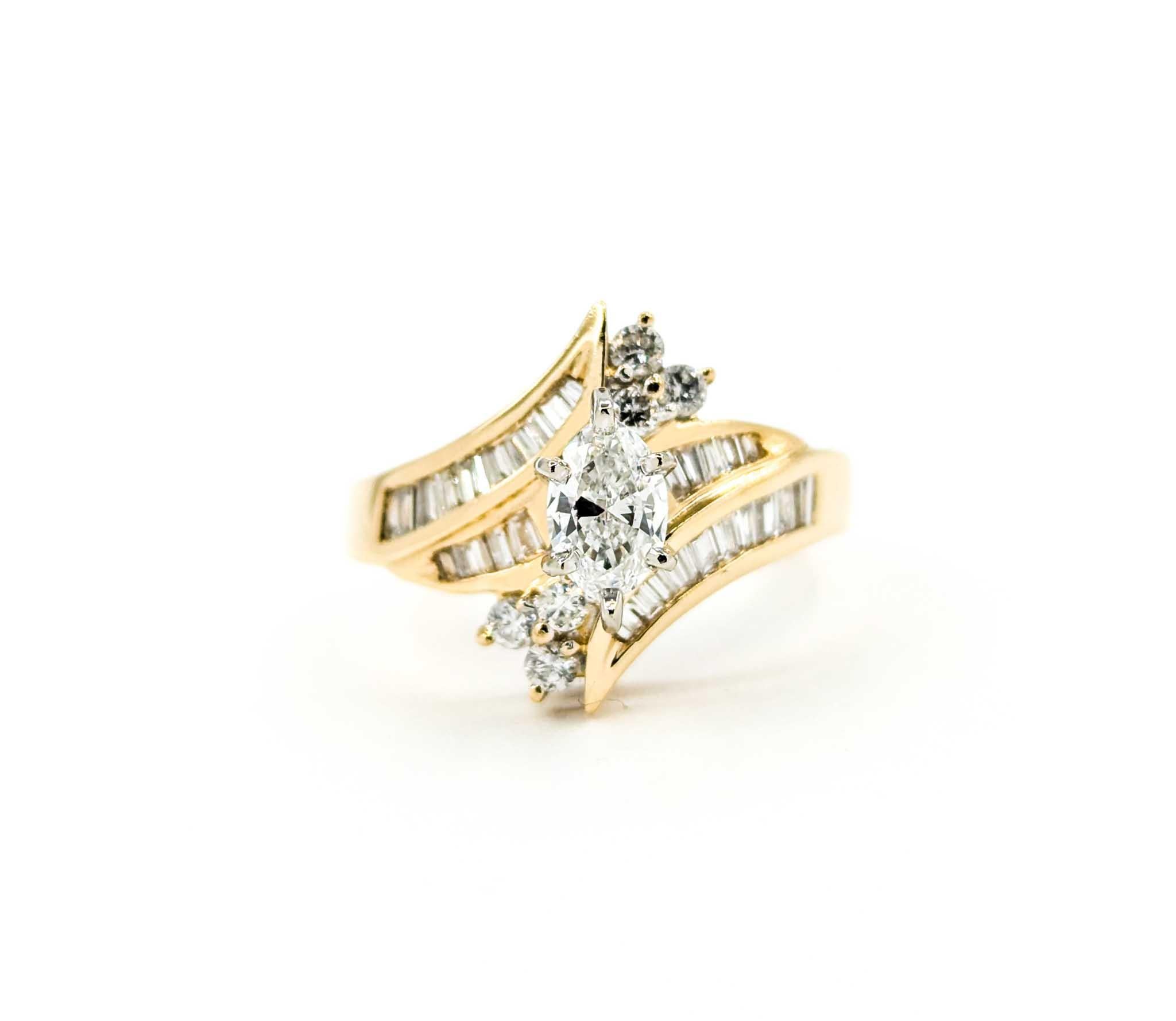 Vintage Marquise & Baguette Diamond Engagment Ring in Yellow Gold

This beautiful vintage diamond engagement ring is crafted in 14k yellow gold and features 0.75ctw in glittering diamonds with a Marquise centerstone. The center marquise diamond is