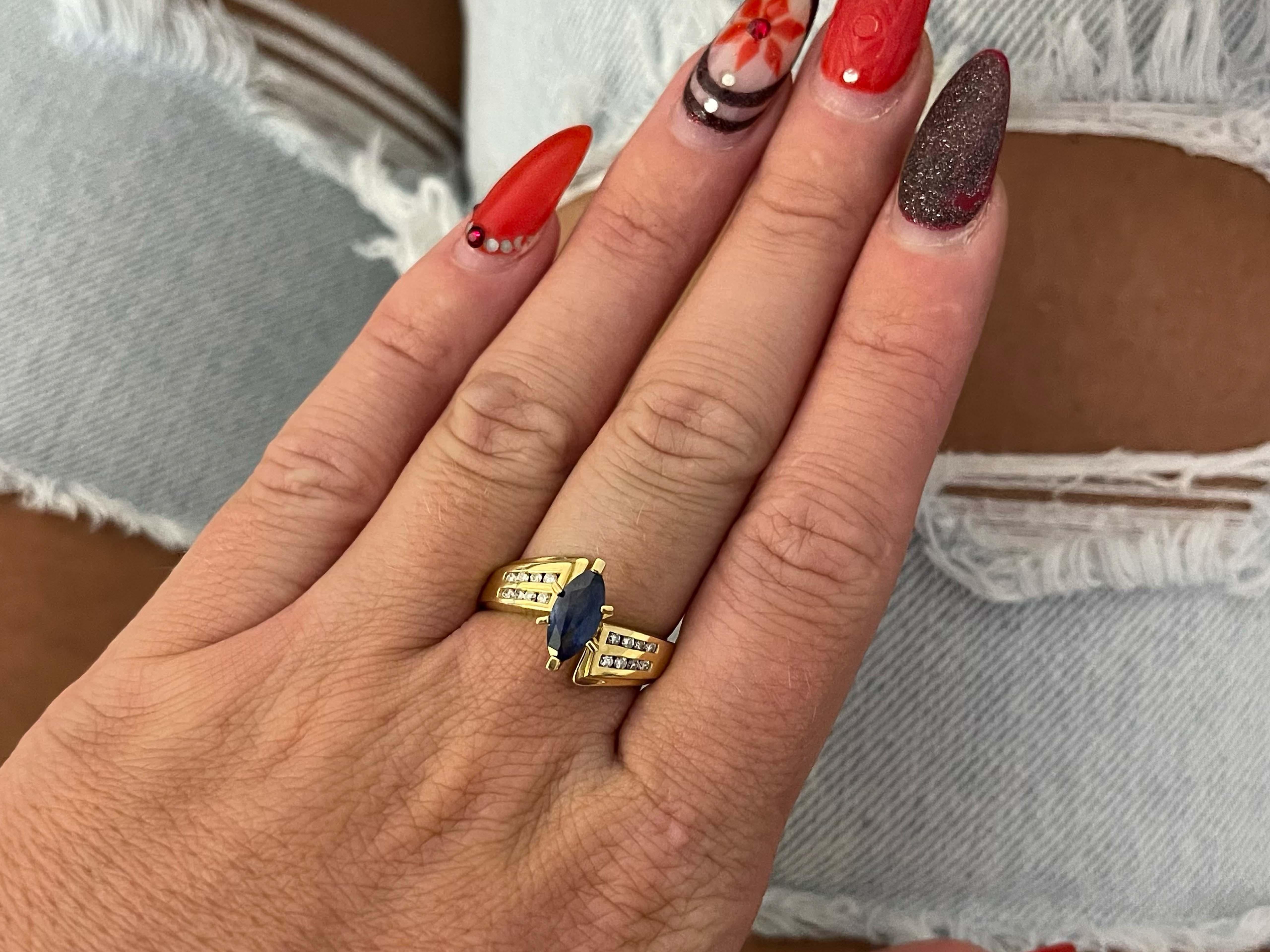 Item Specifications:

Metal: 14K Yellow Gold

Style: Statement Ring

Ring Size: 7.75 (resizing available for a fee)

Total Weight: 5.5 Grams

Ring Height: 12 mm

Gemstone Specifications:

Gemstone: 1 blue sapphire

Shape: marquise

Sapphire