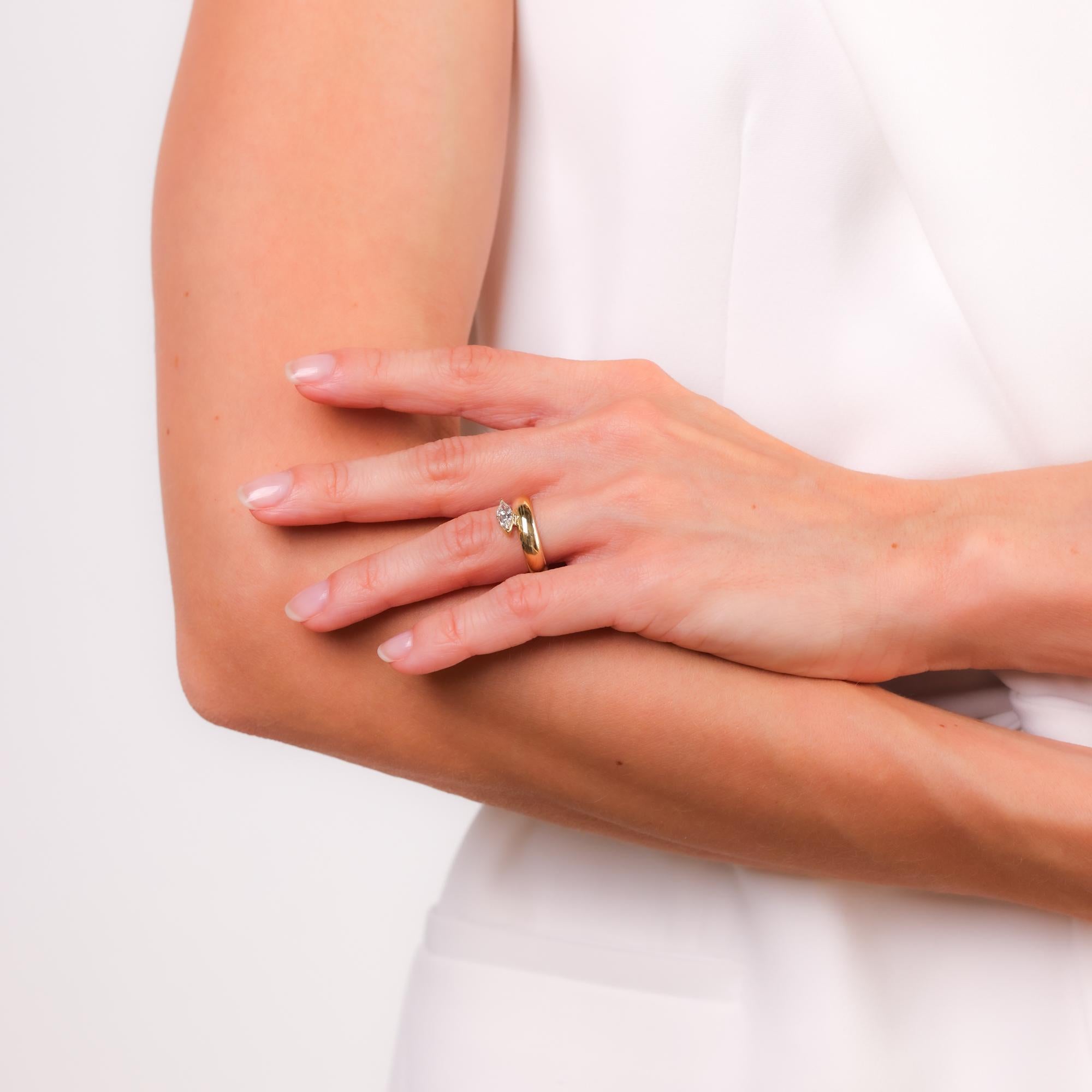 This vintage solitaire band features a striking 0.50 carat marquise cut diamond, set in a classic 14k yellow gold design with timeless appeal.

Center stone: Marquise cut diamond
Weight: Approximately .50 carat
Color: H
Clarity: VS
Metal: 14k yellow