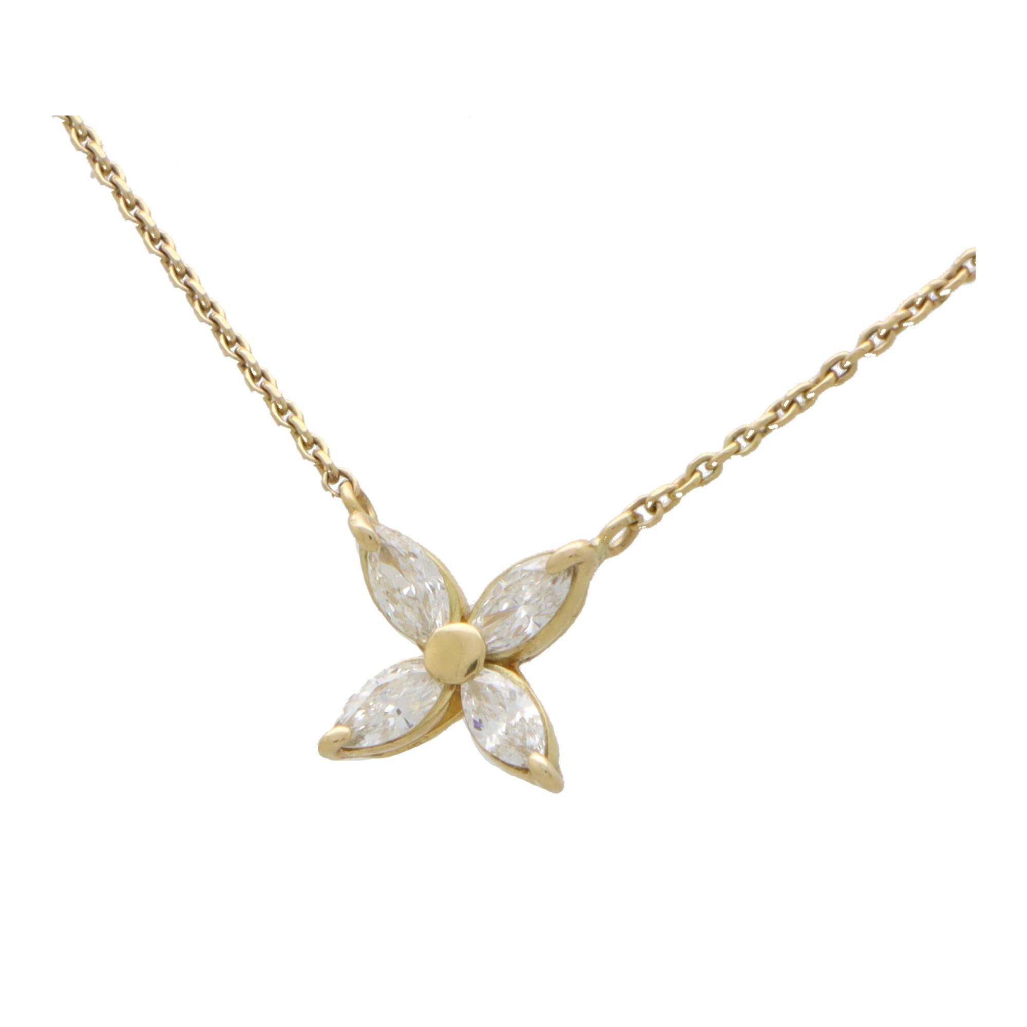 A beautiful vintage marquise diamond pendant necklace set in 18k yellow gold.

The pendant is composed of 4 marquise cut diamonds stones, set in this elegant floral motif. The pendant hangs from a 16-inch yellow gold trace chain. 

Due to the design