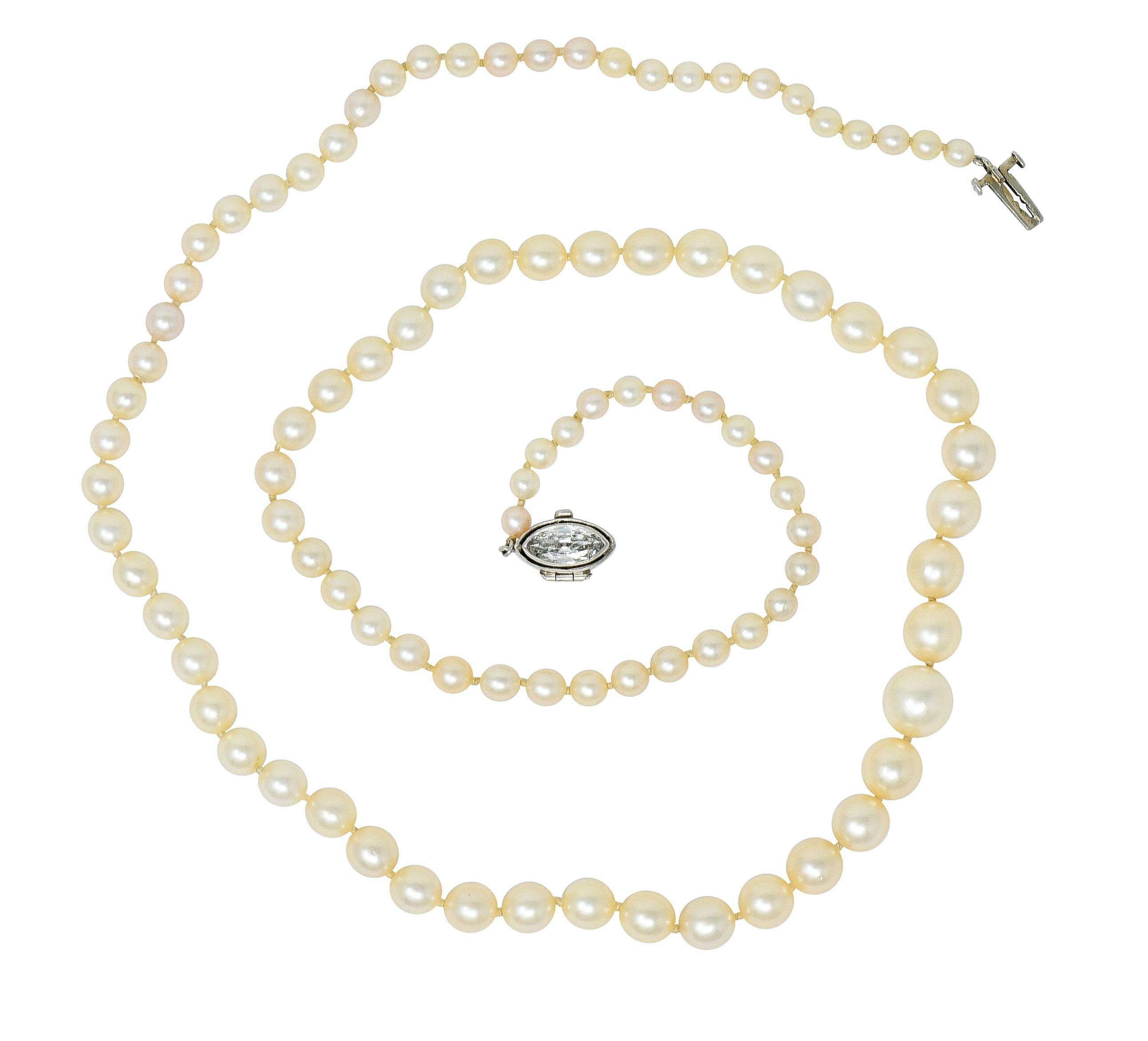 Strand necklace is hand knotted with round cultured pearls that measure 3.2 mm to 7.3 mm, graduating in size

Very well-matched with cream body color and very good luster

Clasp is bezel set with a marquise cut diamond weighing approximately 0.47