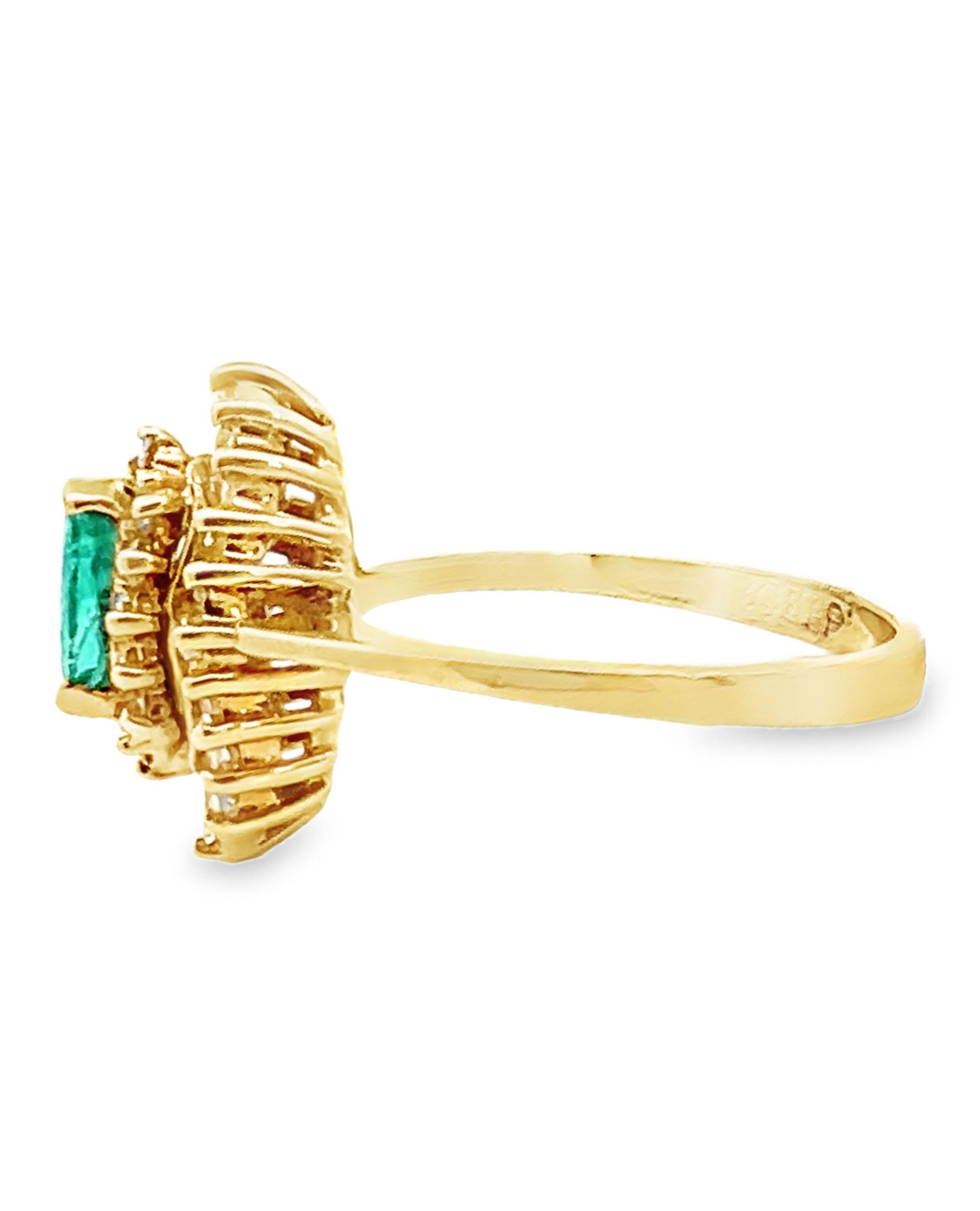 Vintage 18K yellow gold ring with one marquise emerald 0.30 carats.

20 baguette diamonds and 12 round diamonds totaling 0.68 carats. (Created circa 1985)

- Finger Size 6
- Diamonds are G/H color, VS clarity
- Not preowned