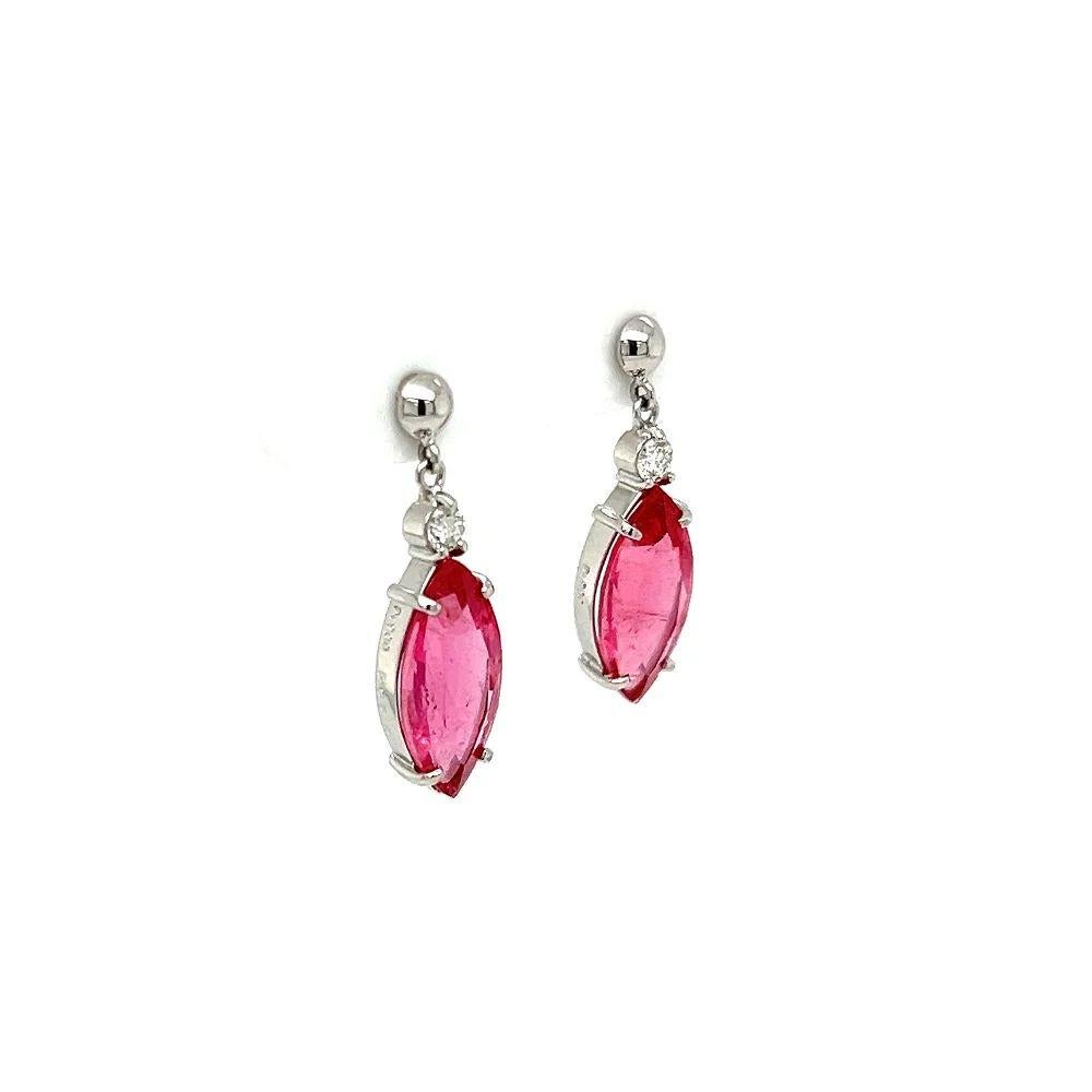 Simply Beautiful! Finely detailed Vintage Marquise Rubellite Tourmaline and Diamond Platinum Drop Earrings. Hand set with Marquise Rubellite Tourmaline, weighing approx. 5.05tcw and Diamonds, weighing approx. 0.16tcw. Post and butterfly system. Hand