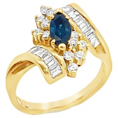Bague vintage en or 18 carats avec saphir marquise et diamants baguettes et ronds