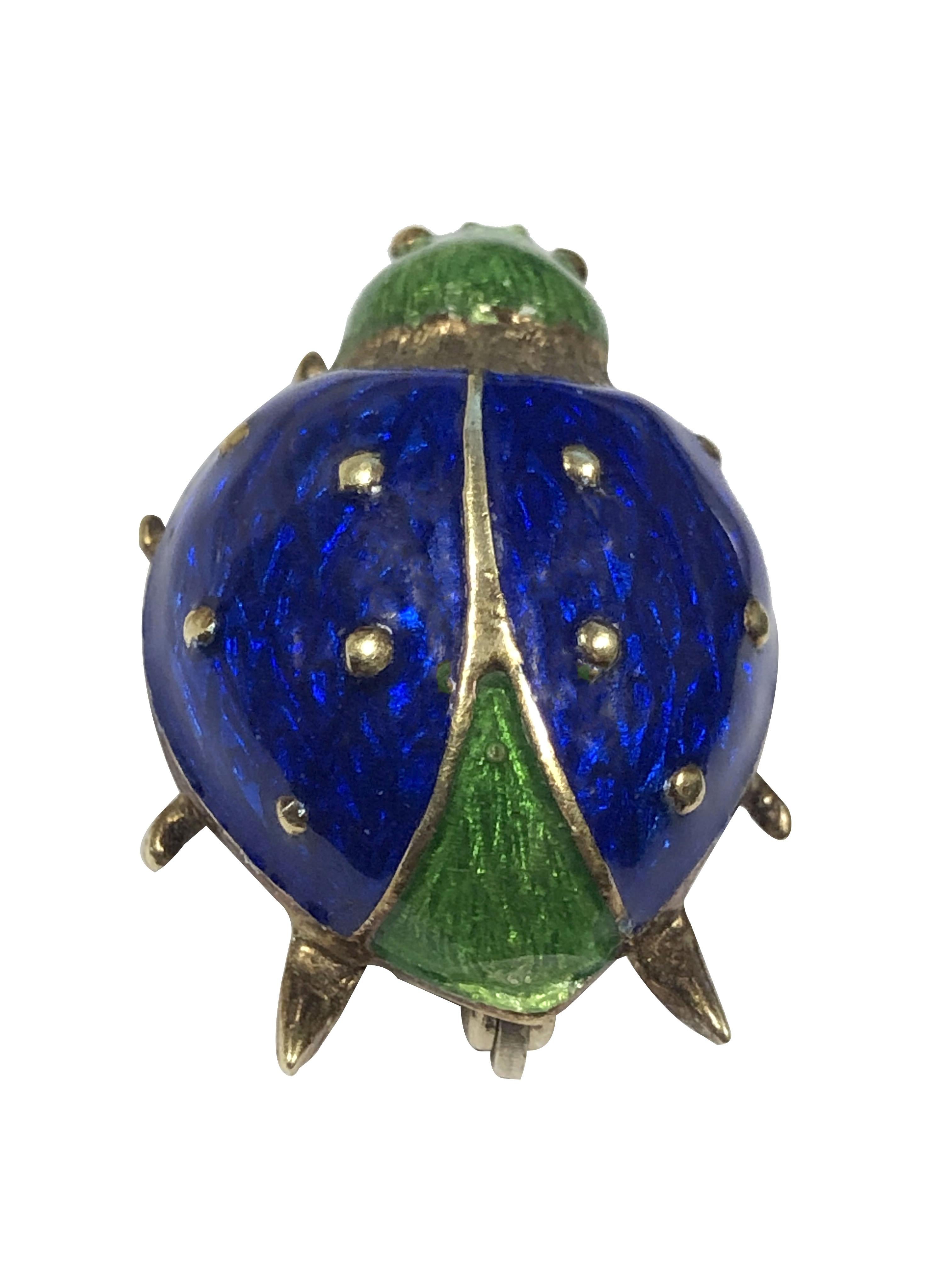 Circa 1980 Martine 14k Yellow Gold bug Brooch, measuring 1 inch X 5/8 inch and weighing 6.6 Grams, finished in bright colorful Guilloche Enamel. 
