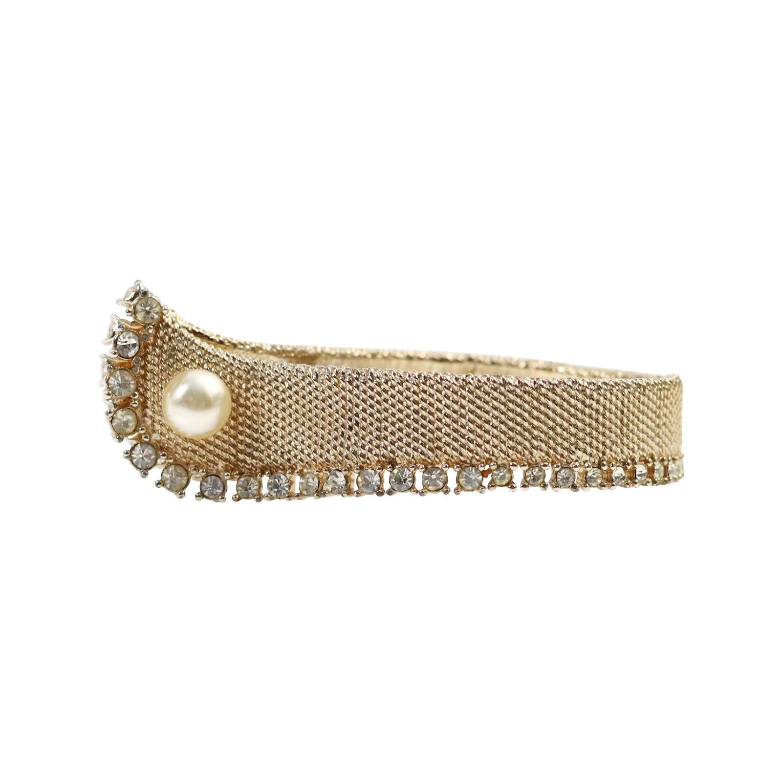 Vintage Marvella Gold Tone with Diamante and Faux Pearl Cuff Circa 1960s. This is one of the unusual cuffs I have ever seen.  It looks like a cuff at the bottom of  a shirt and is sure to be a show stopper and a conversation piece.  It closes with a