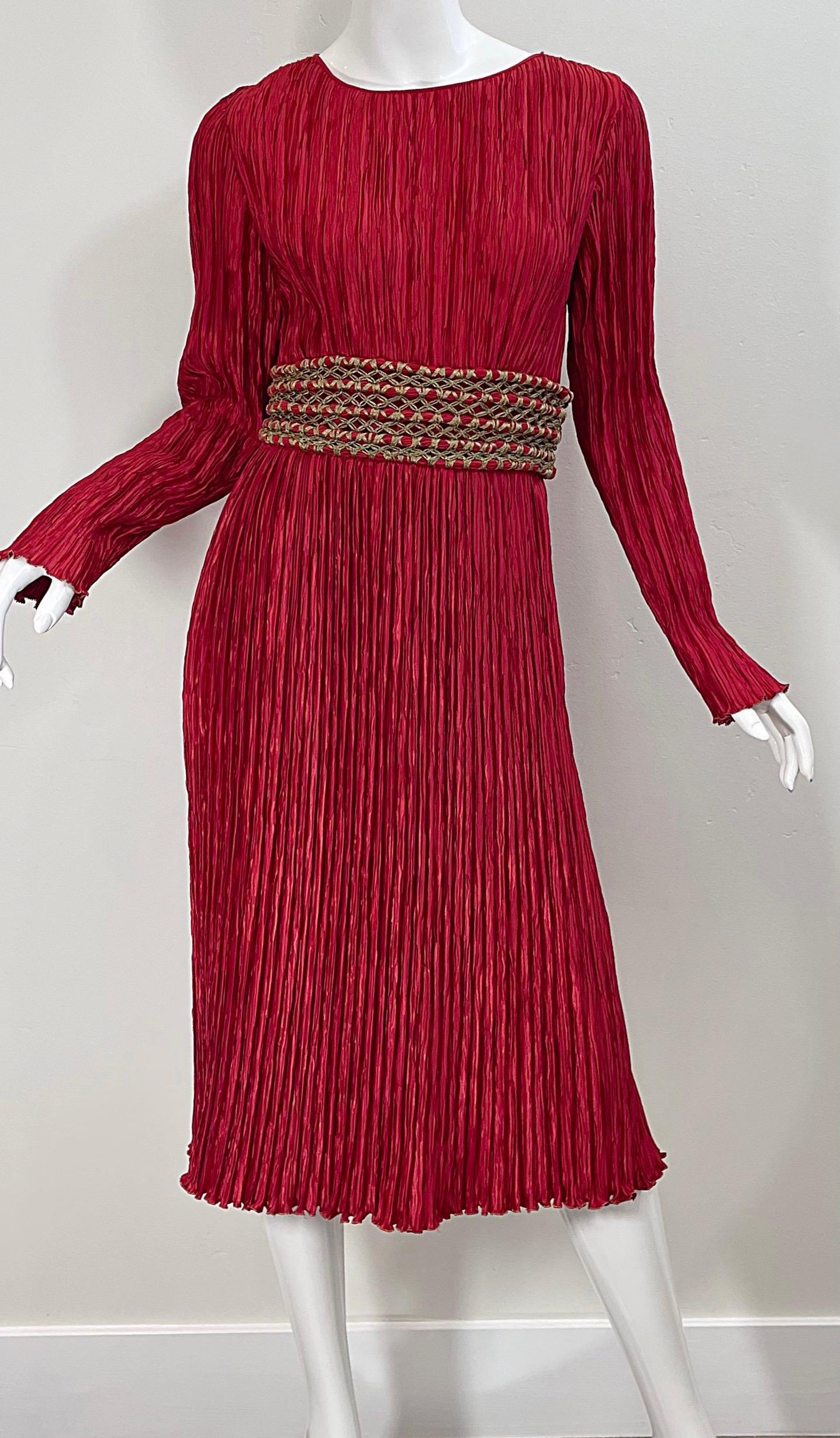 Chic late 1980s MARY MCFADDEN COUTURE crimson red fortuny pleated long sleeve dress ! Features signature flattering fortuny pleating that has plenty of give. Gold embroidered braided belt detail has hook-and-eye closures at the side. Hidden zipper