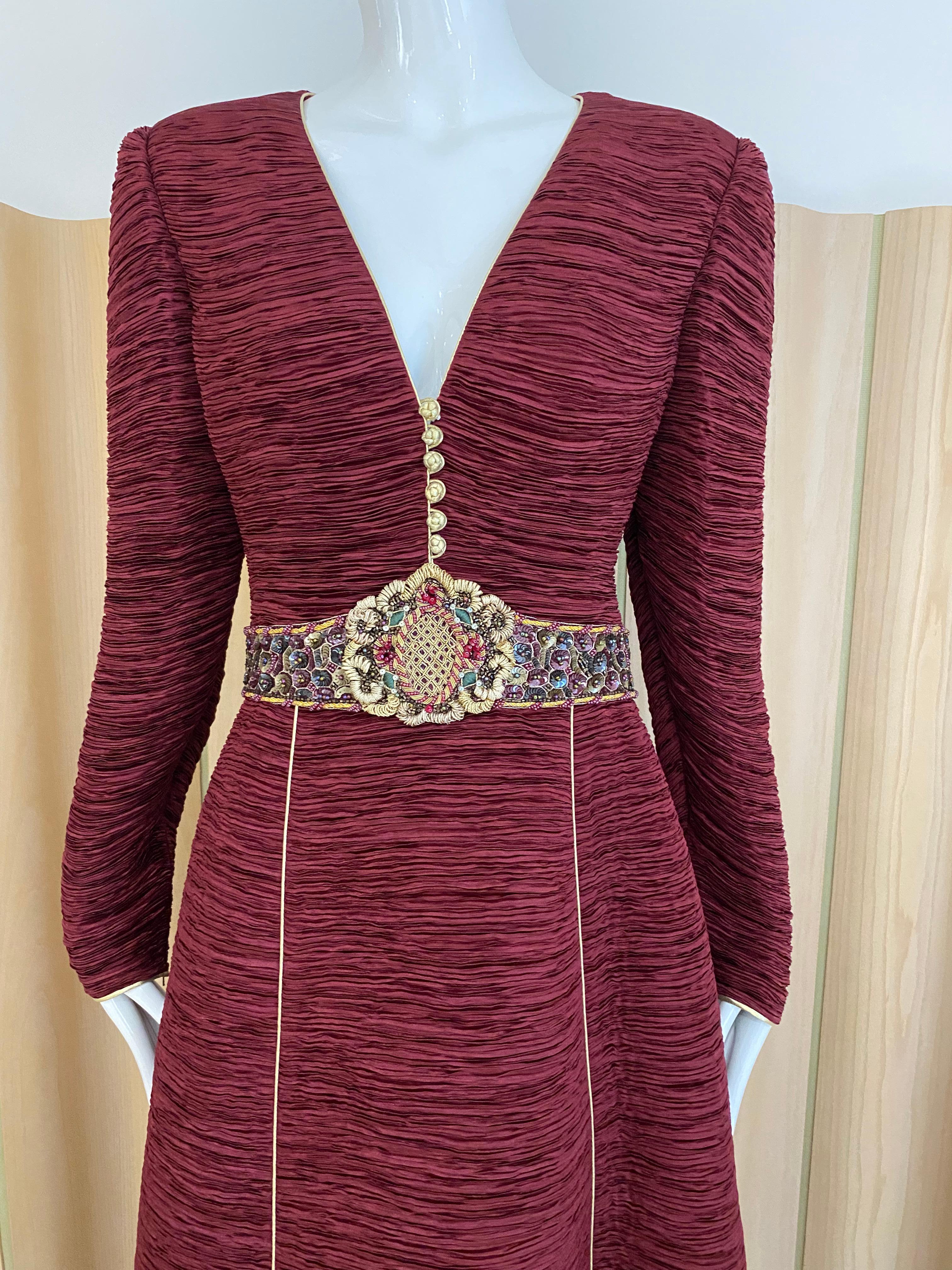 Beautiful 90s Marcy Mcfadden Couture Burgundy Long Sleeve V neck gown with gold frog closures and embellished waist. LARGE size
Measurement :
Bust: 42” / Waist: 33’ Hip: 48” / Dress Length: 60”/ Sleeve length: 26”/ Shoulder: 16.5