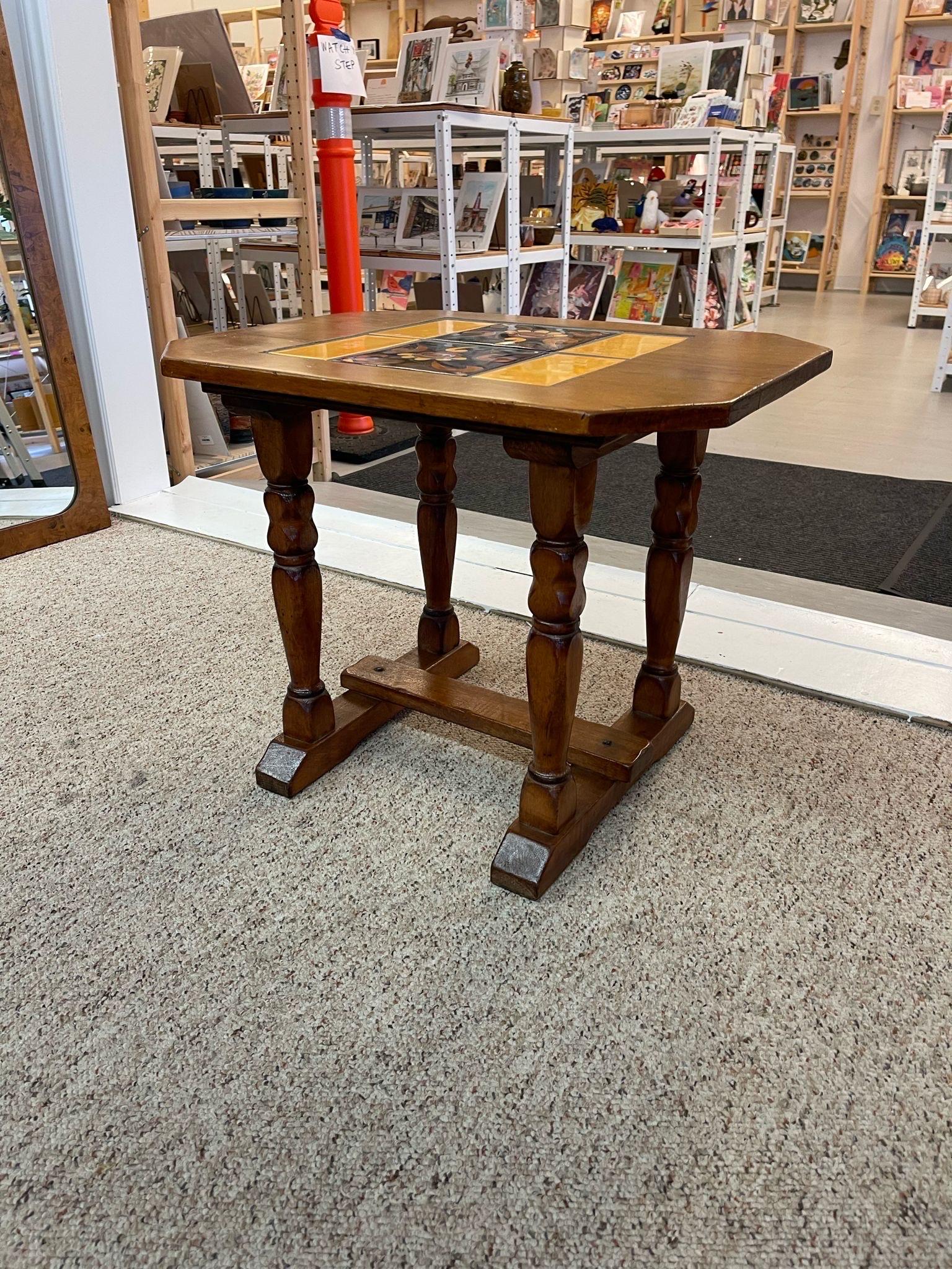 Vintage Catalina Style Accent Table with 6 Yellow and Black Colored Tiles. Turned Legs with stretcher. Makers Mark on the Bottom. Vintage Condition Consistent with Age as Pictured.

Dimensions. 24 W ; 18 D ; 29 H