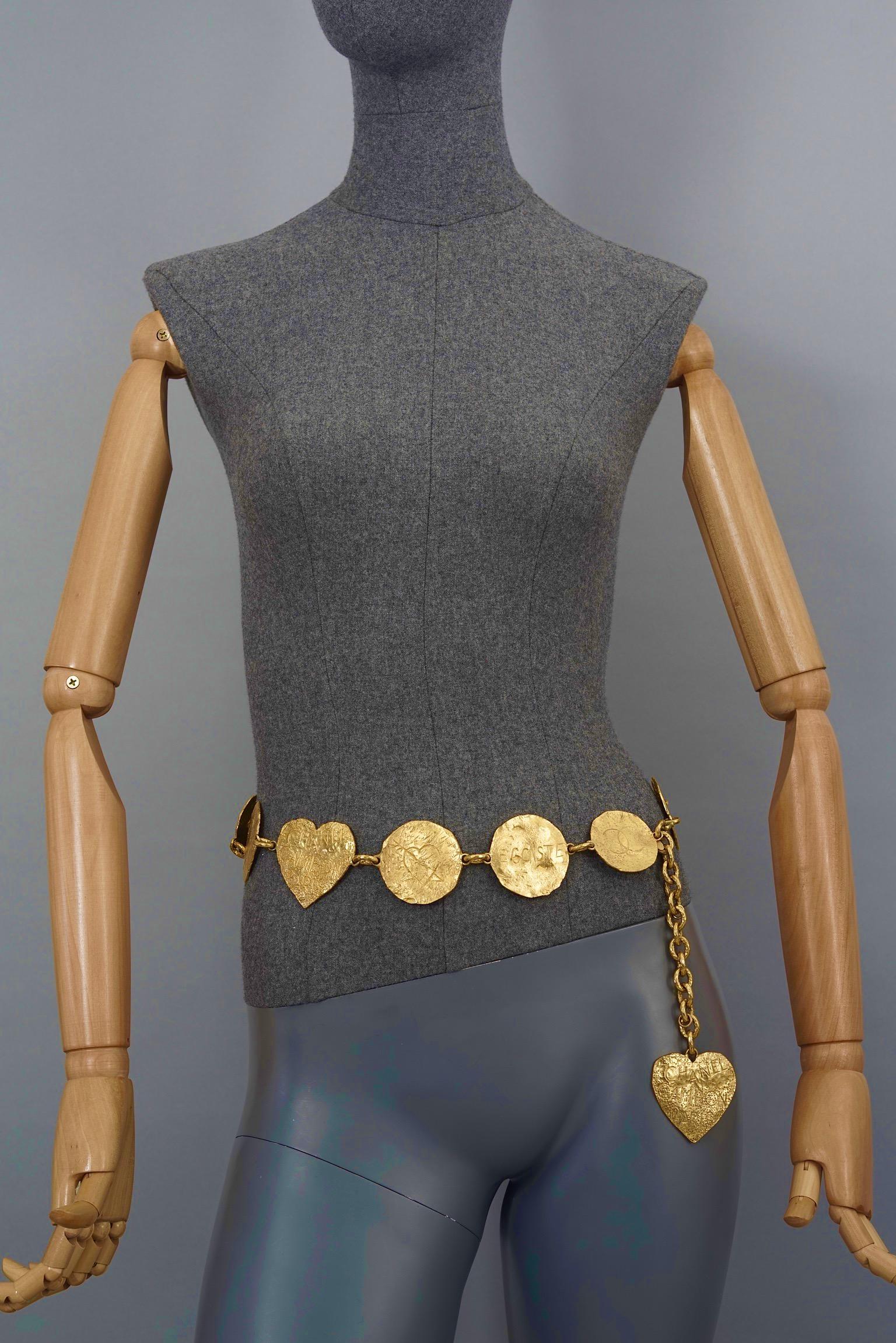 Vintage Massive 1993 CHANEL Logo Graffiti Medallion Heart Charm Belt

Measurements:
Height: 2.20 inches (5.6 cm) 
Maximum Wearable Length: 33.46 inches (85 cm) adjustable

Features:
- 100% Authentic CHANEL from 1993 Cruise Collection.
- 12 Graffiti