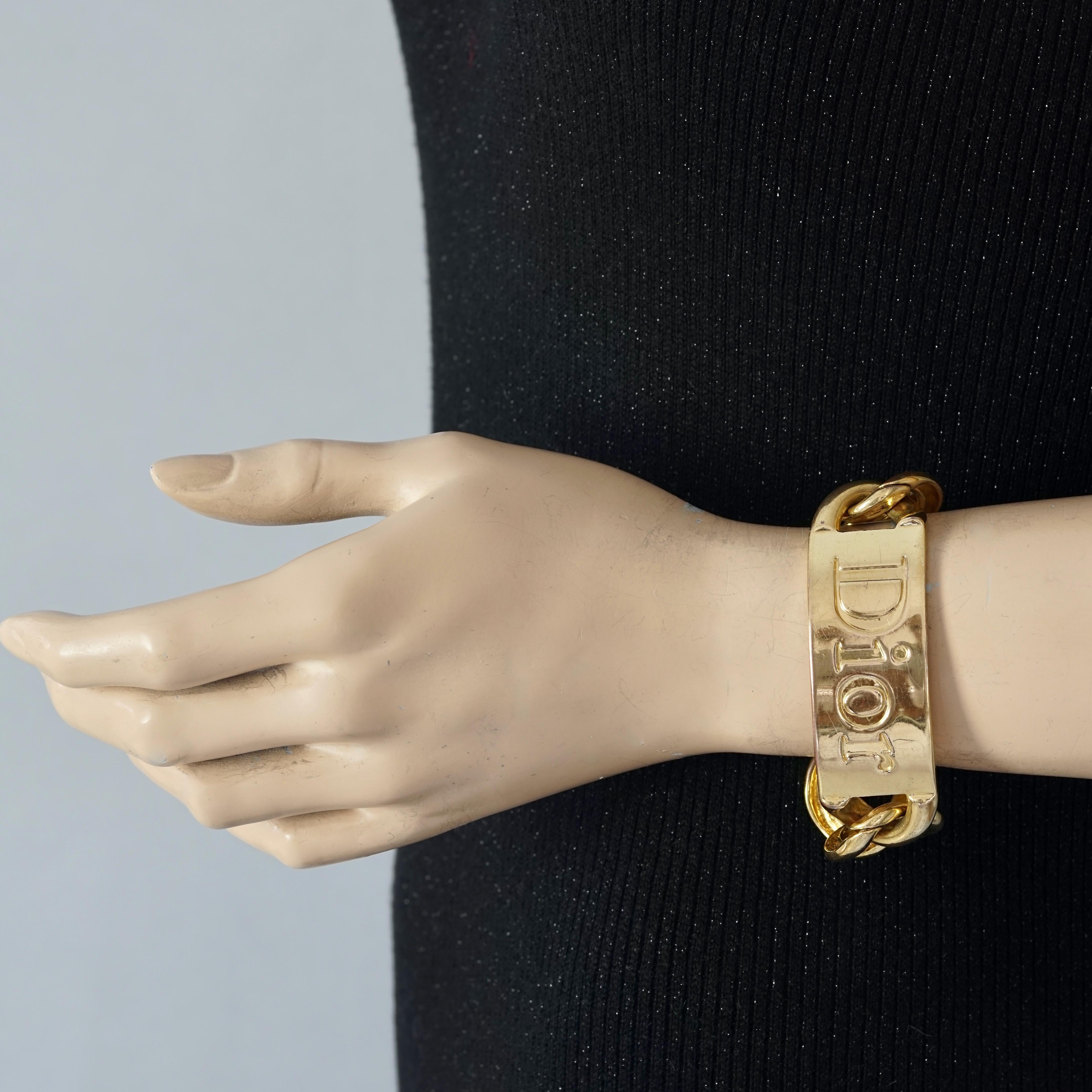 Vintage Massive CHRISTIAN DIOR by John Galliano Name Plate Chain Bracelet

Measurements:
Height: 0.98 inch (2.5 cm)
WearableLength: 7.48 inches (19 cm) 

Features:
- 100% Authentic CHRISTIAN DIOR.
- Massive/ chunky name plate and chain bracelet.
-