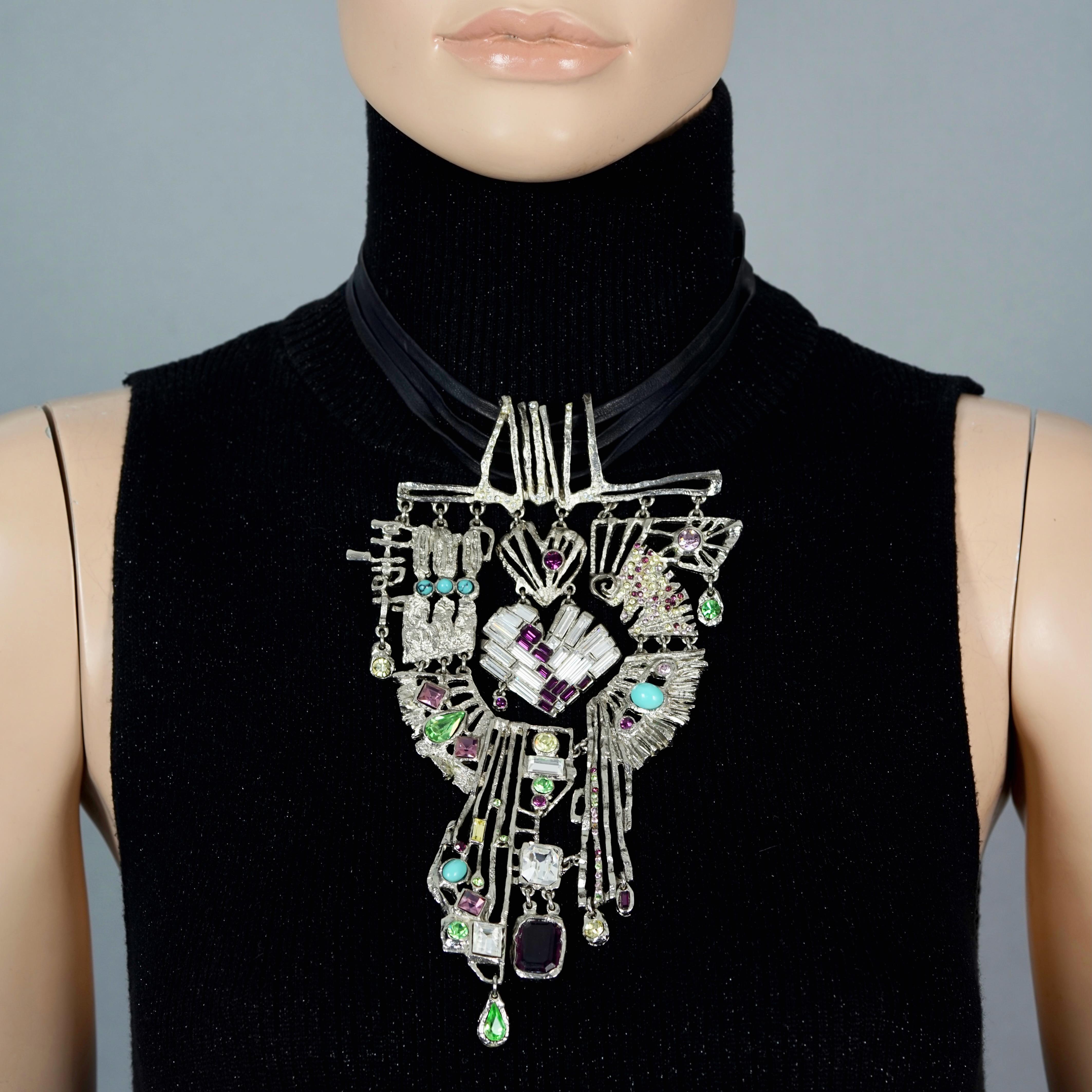 Vintage Massive CHRISTIAN LACROIX Dramatic Jewelled Cross Necklace

Measurements:
Height: 7.87 inches (20 cm)
Width: 4.72 inches (12 cm)
Wearable Length: 14.37 inches (36.5 cm) until 15.94 inches (40.5 cm)

Features:
- 100% Authentic CHRISTIAN