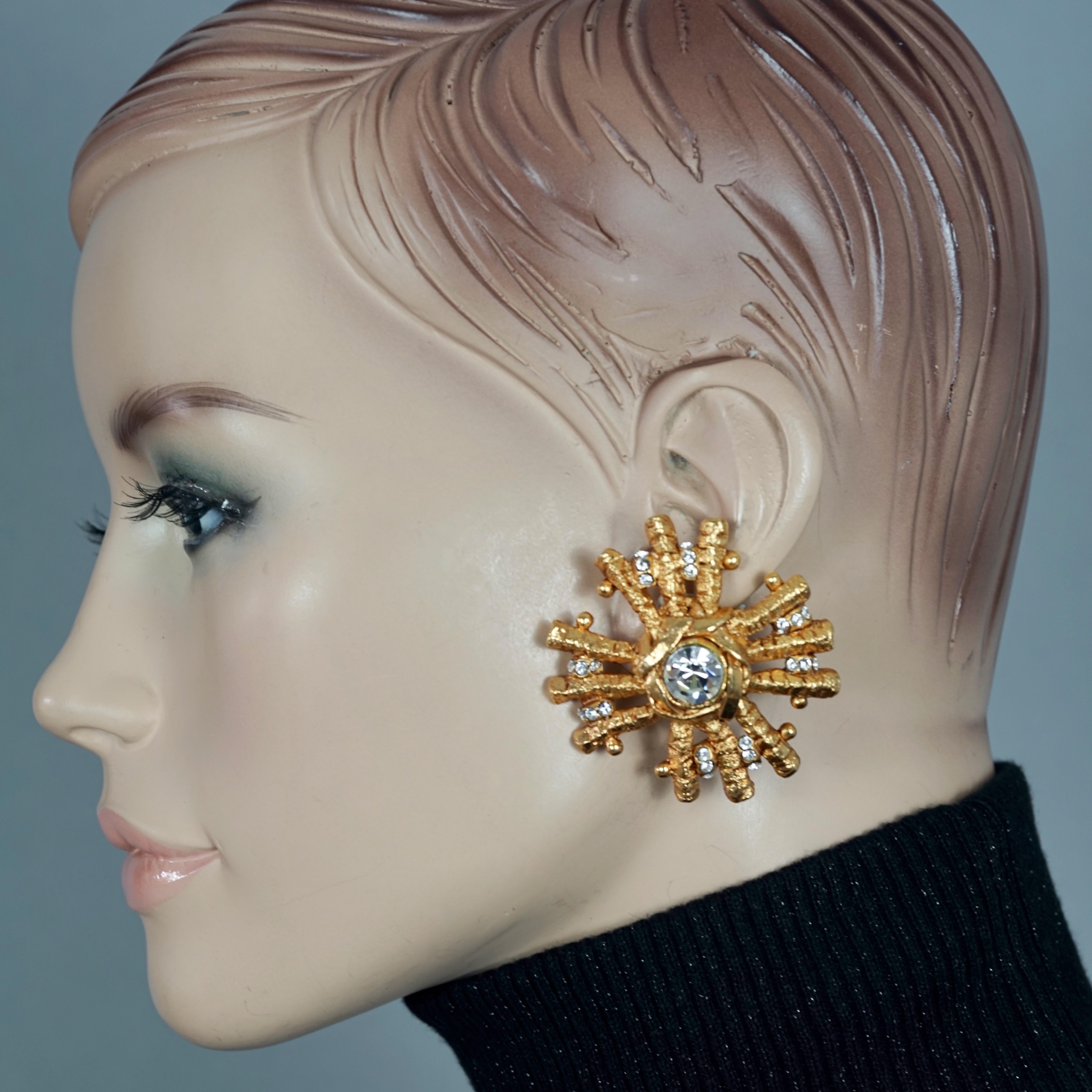 Vintage Massive CHRISTIAN LACROIX Sunburst Rhinestone Earrings

Measurements:
Height: 2.05 inches (5.2 cm)
Width: 1.97 inches (5 cm)
Weight per Earring: 26 grams

Features:
- 100% Authentic CHRISTIAN LACROIX.
- Massive sunburst earrings with