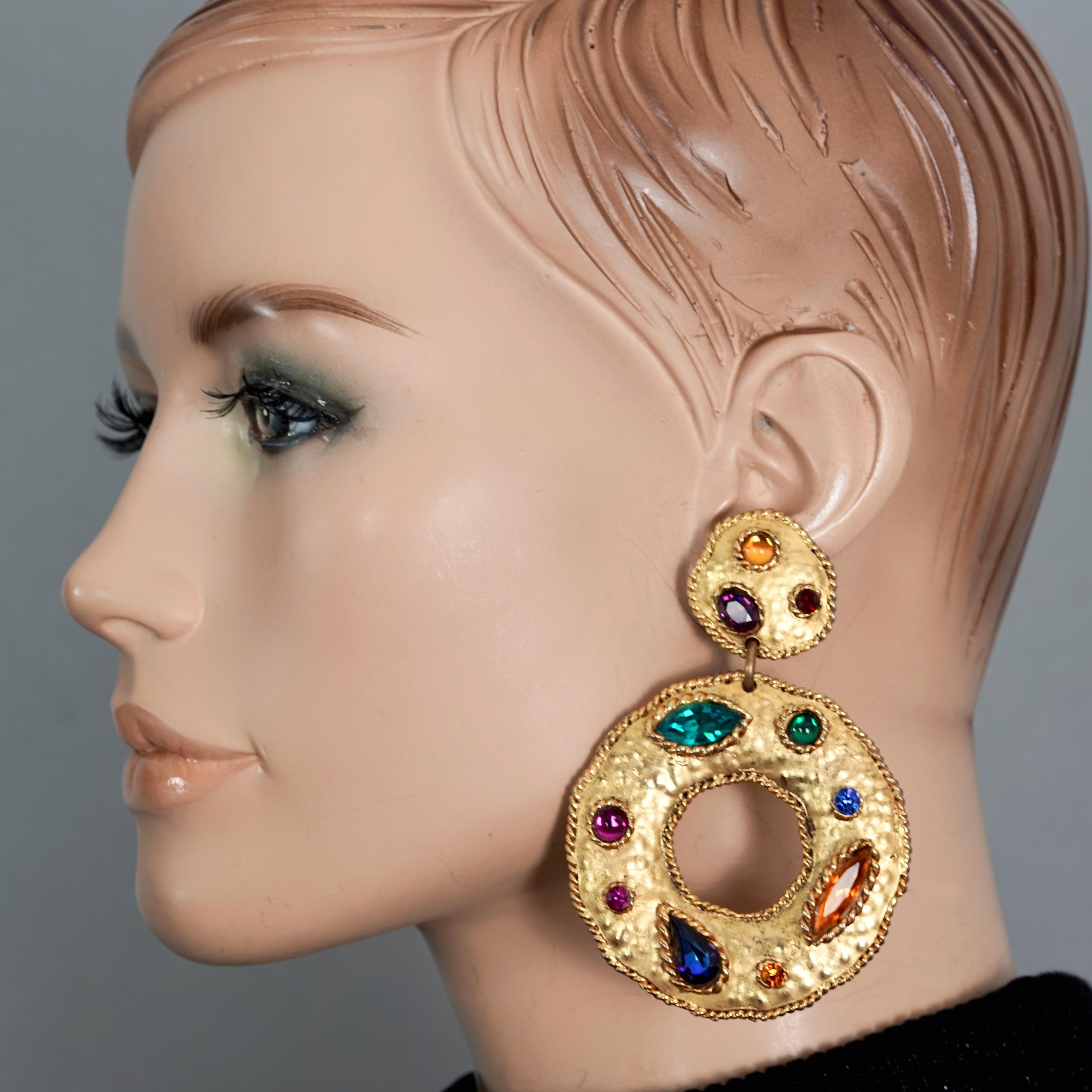 Vintage Massive EDOUARD RAMBAUD Jewelled Hoop Dangling Earrings

Measurements:
Height: 3.54 inches (9 cm)
Width: 2.36 inches (6 cm)
Weight per Earring: 32 grams

Features:
- 100% Authentic EDOUARD RAMBAUD.
- Massive hammered hoop dangling