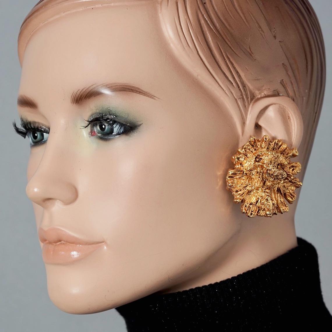 Vintage Massive GEORGES RECH Textured Molten Flower Earrings

Measurement:
Height: 1.85 inches (4.7 cm)
Width: 1.73 inches (4.4 cm)
Weight per Earring: 14 grams

Features:
- 100% Authentic GEORGES RECH.
- Massive textured molten flower earrings.
-