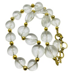 Collier vintage en résine massive dorée avec perles de créateur