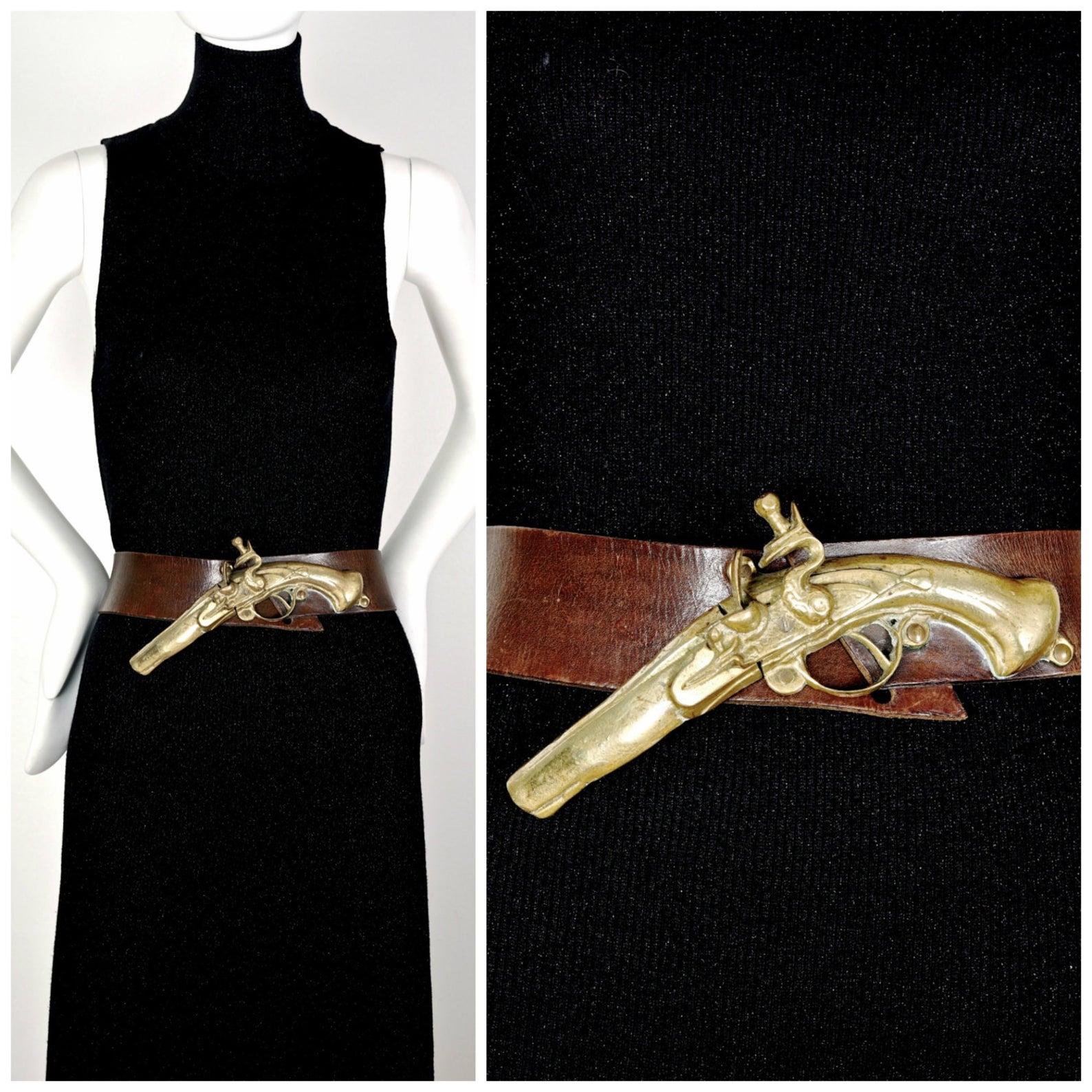 Vintage Massive GUY LAROCHE 3 Dimensional Elaborate Gun Pistol Belt

Measurements:
Gun/ Pistol: 3 1/8 inches (7.93 cms) X 9 3/8 inches (23.81 cms)
Wearable Length: 28 inches (71.12 cms) until 29 4/8 inches (74.93 cms)

Features:
- 100% Authentic GUY