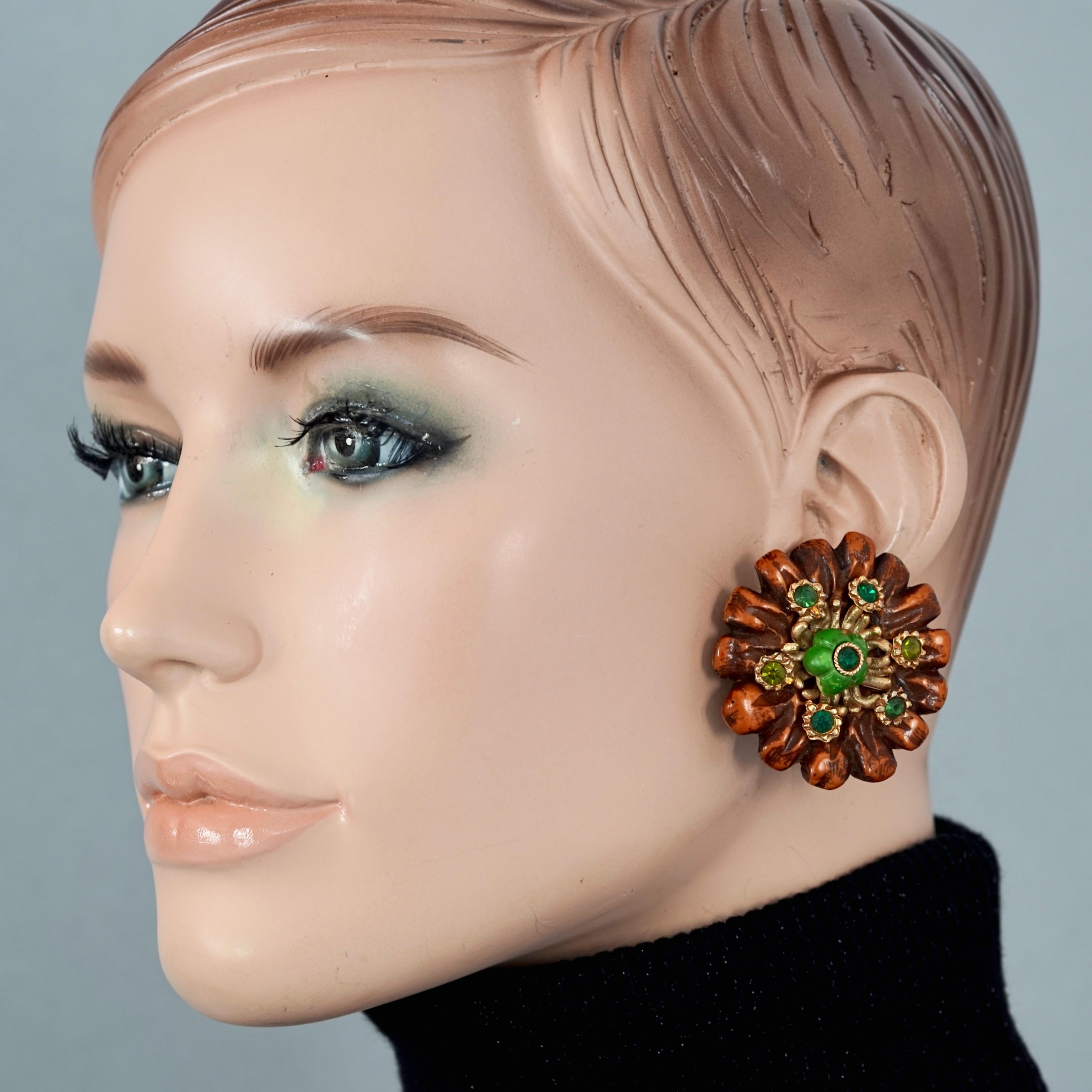 Vintage Massive JACKY DE G Flower Resin with Rhinestones Earrings

Measurements:
Height: 1.73 inches (4.4 cm)
Width: 1.73 inches (4.4 cm)
Weight per Earring: 15 grams

Features:
- 100% Authentic JACKY DE G.
- Massive flower resin earrings in wood