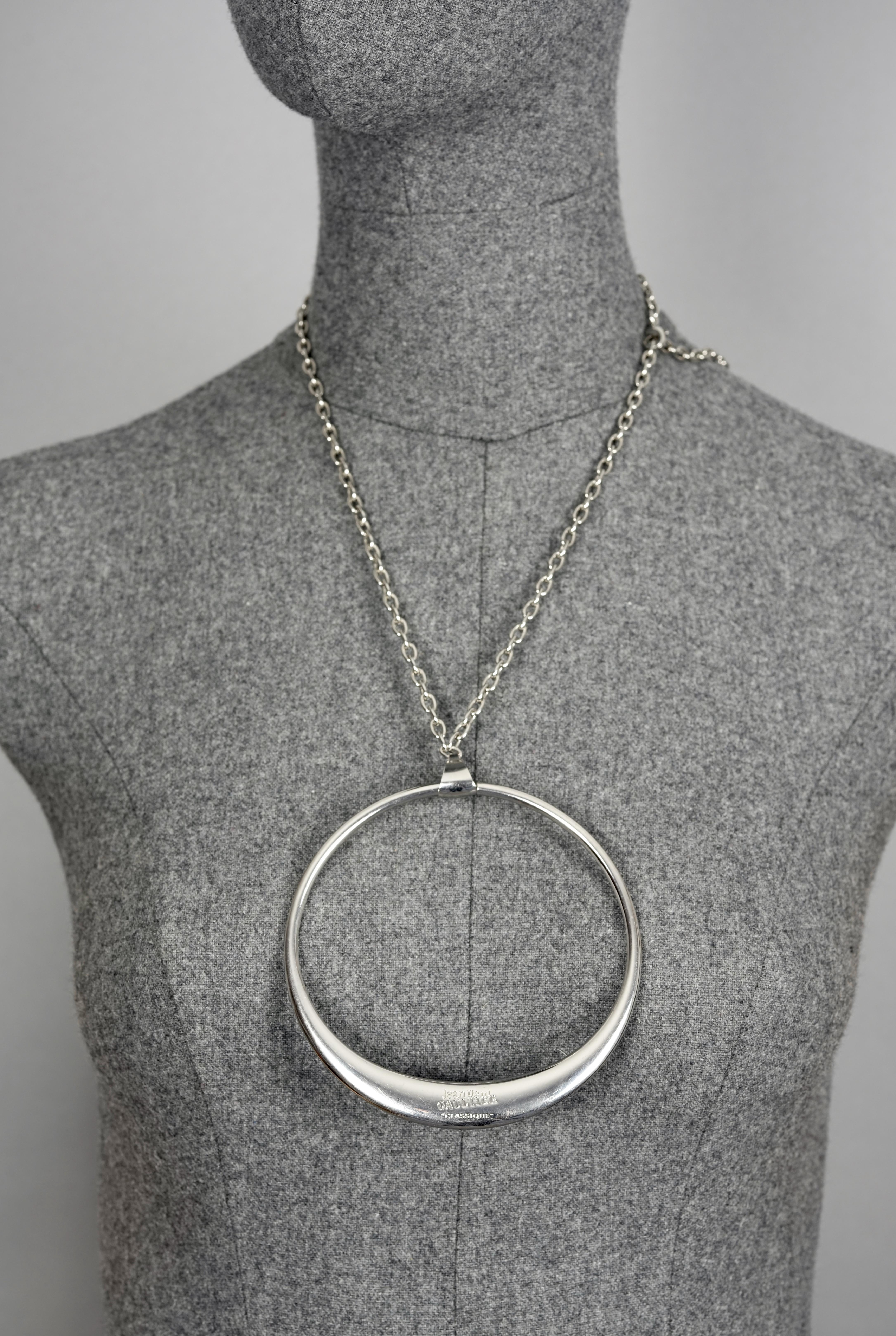 Vintage Massive JEAN PAUL GAULTIER Modernist Ring Pendant Silver Chain Necklace

Measurements:
Height: 4.40 inches (11.2 cm)
Width: 4.13 inches (10.5 cm)
Maximum Length: 15.15 inches (67 cm)

Features:
- 100% Authentic JEAN PAUL GAULTIER.
-