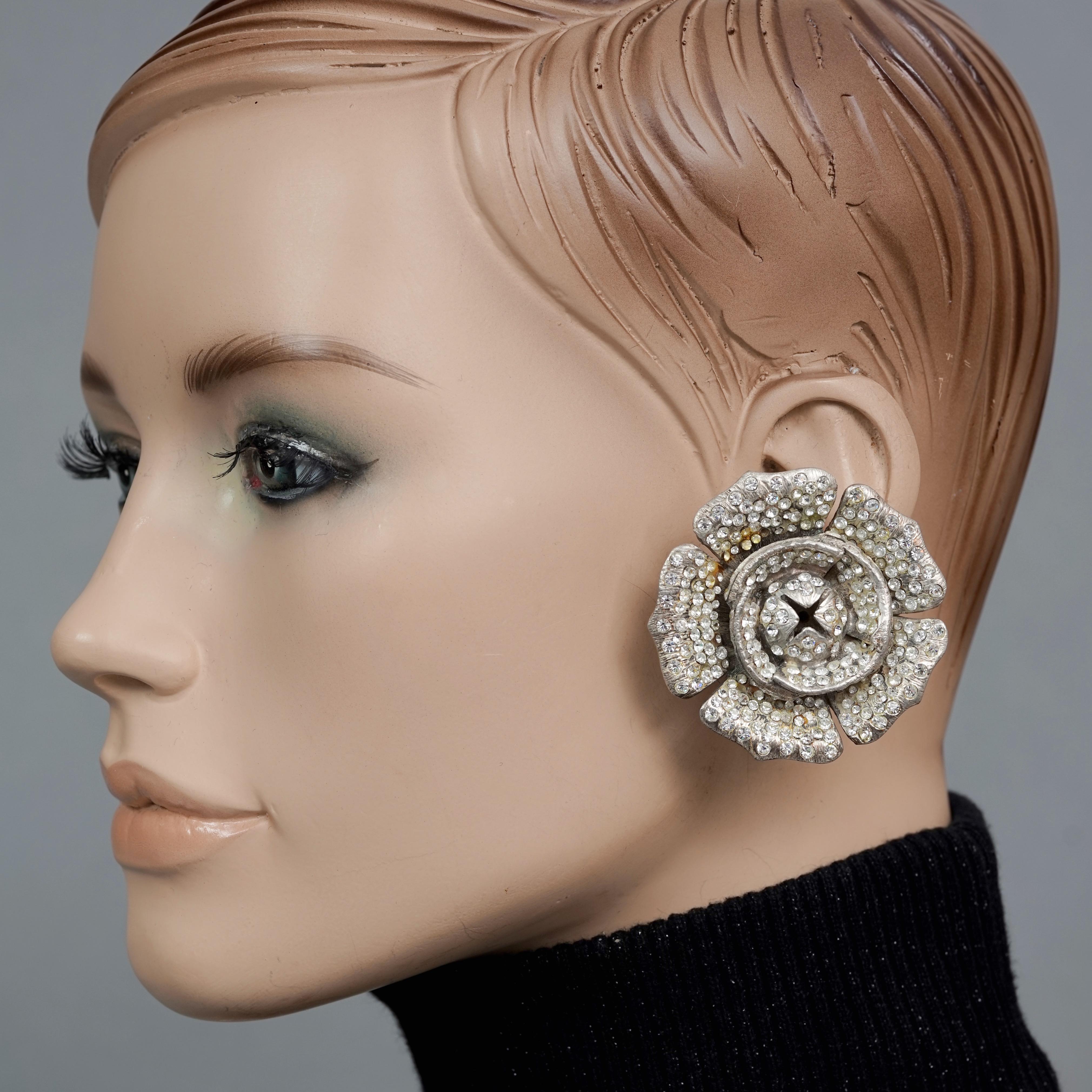 Vintage Massive LANVIN PARIS Flower Rhinestone Silver Earrings

MEASUREMENTS:
Height: 2 inches (5.1 cm)
Width: 2 inches (5.1 cm)
Weight per Earring: 54 grams

Features:
- 100% Authentic LANVIN PARIS.
- Massive 3 dimensional flower earrings studded