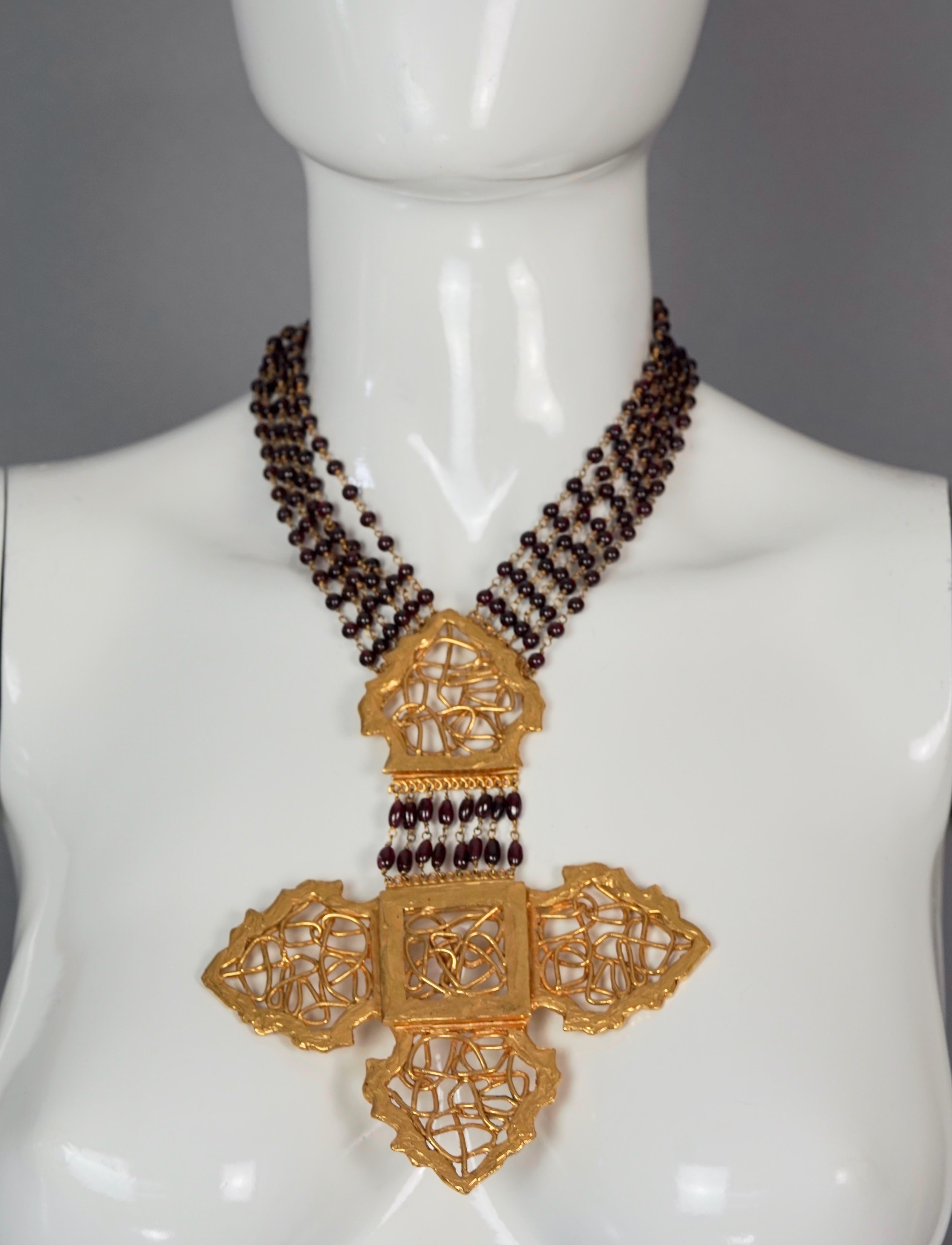 Vintage Massive ROBERT GOOSSENS PARIS Gilt Cross Multi Strand Glass Beaded Necklace

Measurements:
Cross Height: 6.38 inches (16.2 cm)
Cross Width: 5.20 inches (13.2 cm)
Wearable Length: 14.17 inches (36 cm)

Features:
- 100% Authentic ROBERT