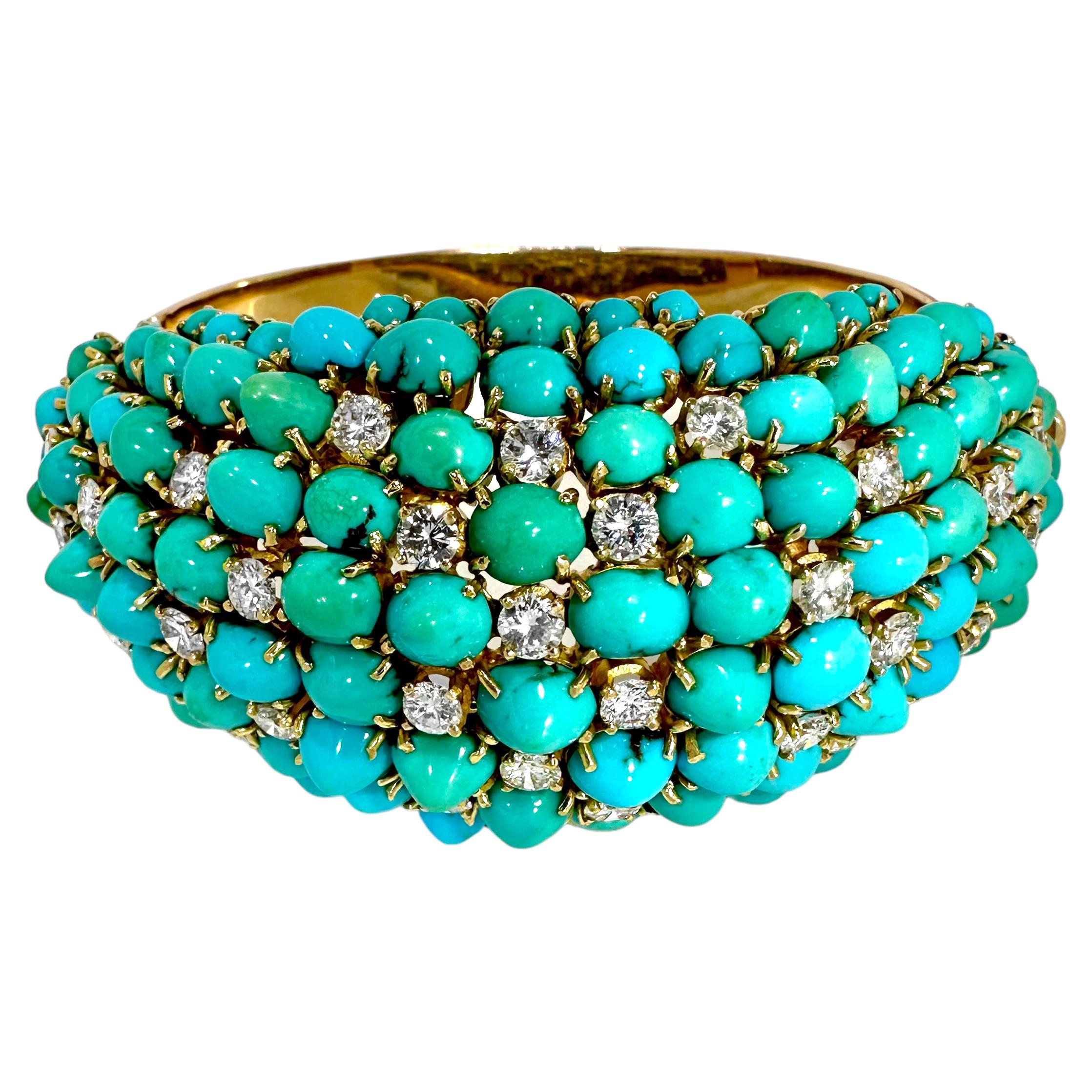 This extraordinary and massive Mid-20th Century, 18k yellow gold, oval shaped bracelet, is generously set with numerous turquoise cabochons in a large and towering bombe dome. Thirty four brilliant cut diamonds are set at various intervals within