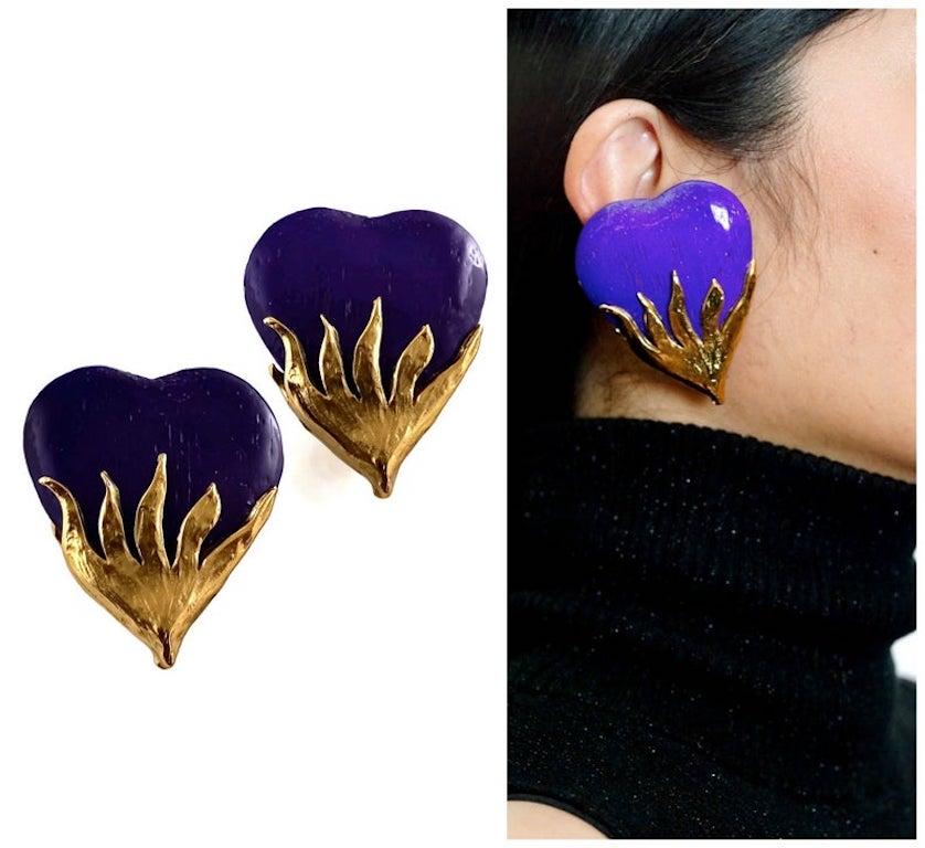 Vintage Massive YSL Yves Saint Laurent Wood Purple Heart Textured Gilt Earrings

Measurements:
Height: 2 3/8 inches (6.03 cm)
Width: 2 inches (5.08 cm)


Features:
- 100% Authentic YVES SAINT LAURENT.
- Purple heart wood with textured gilt at the