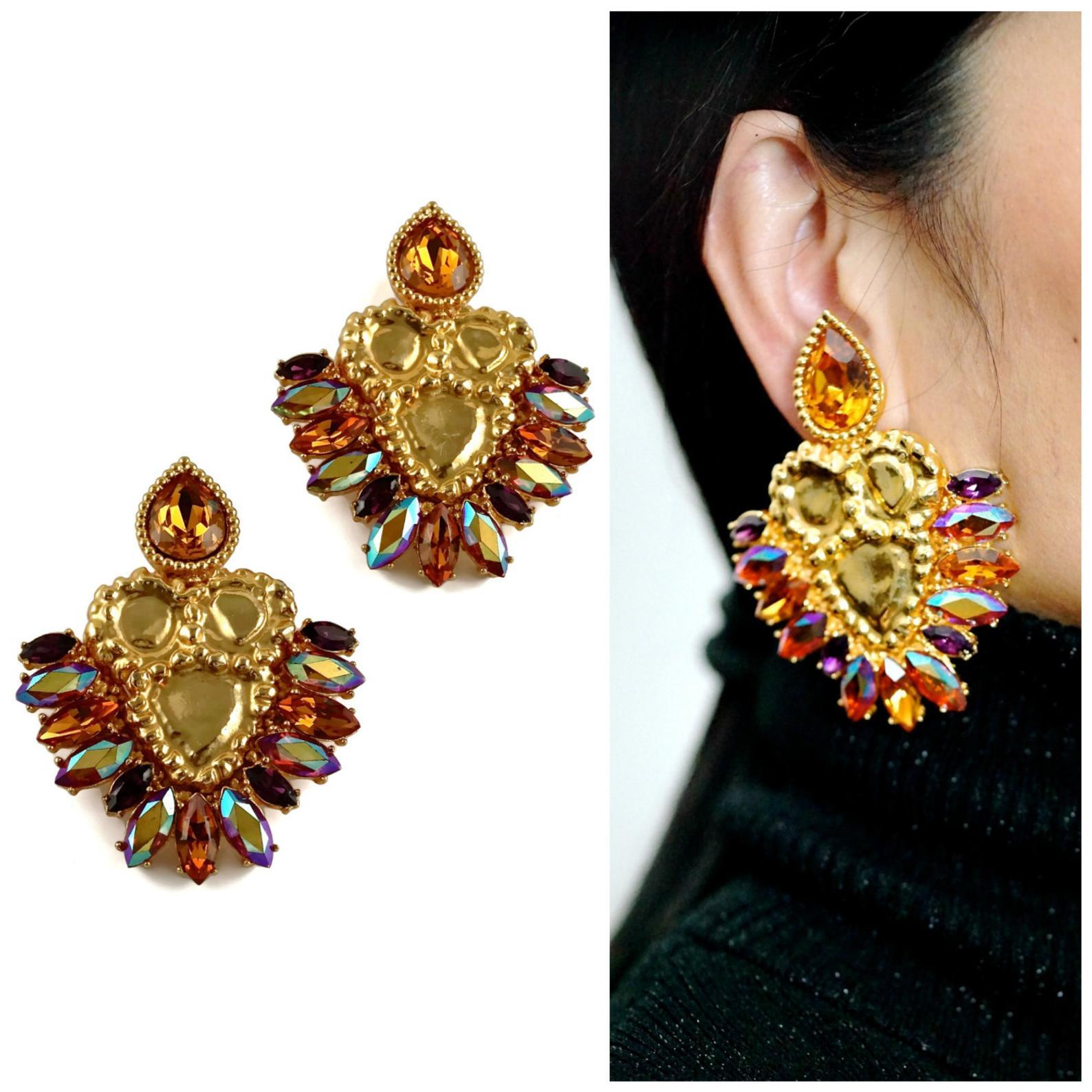 Vintage Massive YVES SAINT LAURENT Iridescent Topaz Rhinestone Jewelled Earrings

Measurements:
Height: 3 1/8 inches (7.93 cm)
Width: 2 3/8 inches (6.03 cm)

Features:
- 100% Authentic YVES SAINT LAURENT.
- Faceted iridescent topaz rhinestones.
-