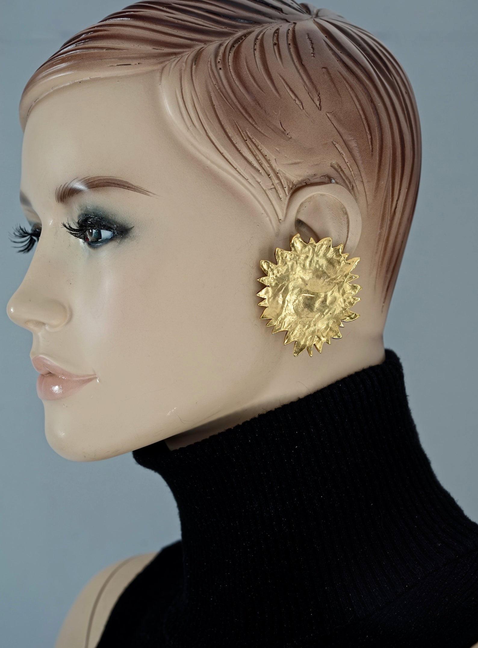 Vintage Massive YVES SAINT LAURENT Ysl by Robert Goossens Textured Sun Earrings

Measurements:
Height: 2.04 inches (5.2 cm)
Width: 1.89 inches (4.8 cm)
Weight per Earring: 16 grams

Features:
- 100% Authentic YVES SAINT LAURENT by Robert Goossens.
-