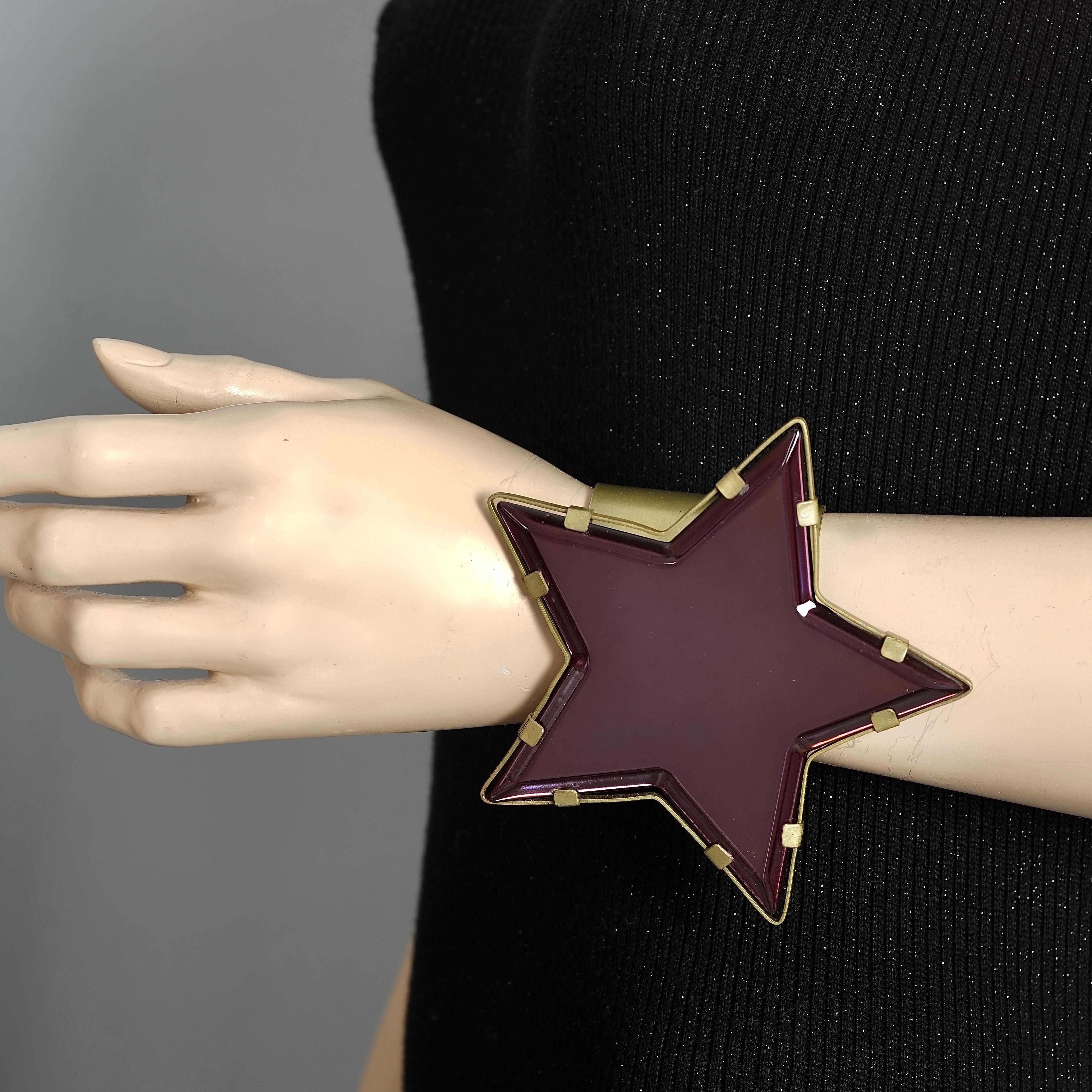 Vintage Massive YVES SAINT LAURENT Ysl Star Plexiglas Mirror Cuff Bracelet by Stefano Pilati

Measurements:
Height: 4.33 inches (11 cm)
Width: 4.33 inches (11 cm)
Inner Circumference: 6.22 inches (15.8 cm) opening included

Features:
- 100%