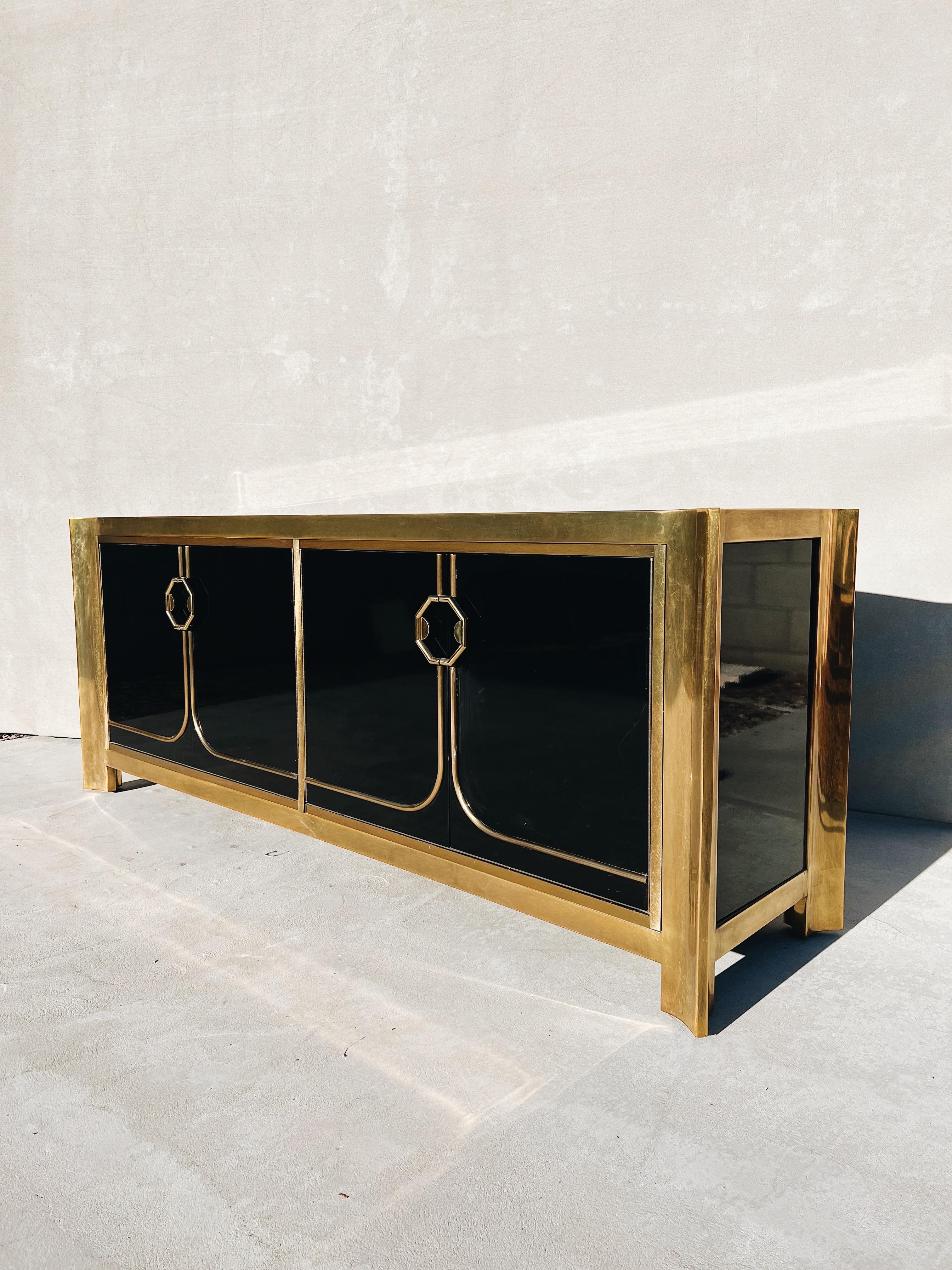 Vintage Mastercraft Brass and Black Lacquer Sideboard

A beautifully dramatic and style forward credenza created by Mastercraft Furniture Company and designed by William Doezema - where the quality of materials and finishes were executed to an