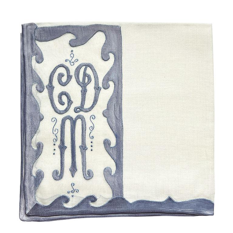A stunning set of 24 vintage embroidered and monogrammed placemats and napkins with service for 12. This gorgeous set is by Shaxted Chicago. A linens company popular in the mid-20th century. Each placemat is created from a sheer white fabric that