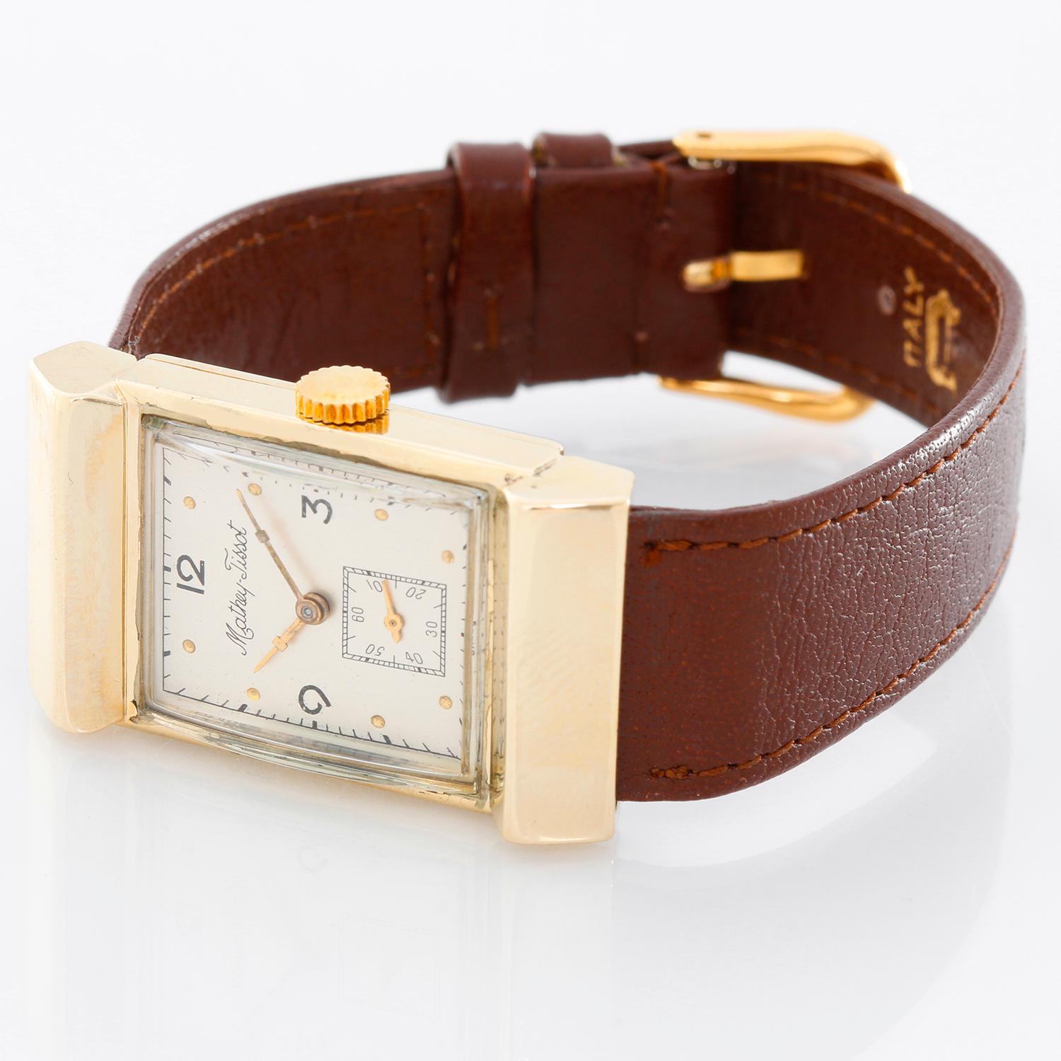 Vintage Mathy Tissot Men's Watch  - Manual . 14K Yellow Gold (  21 x 39 mm ) . Silver dial with Arabic numbers at 12, 3,  and 9 o'clock . Brown buffalo strap . Pre-owned with custom box. Circa 1940-1950's  .