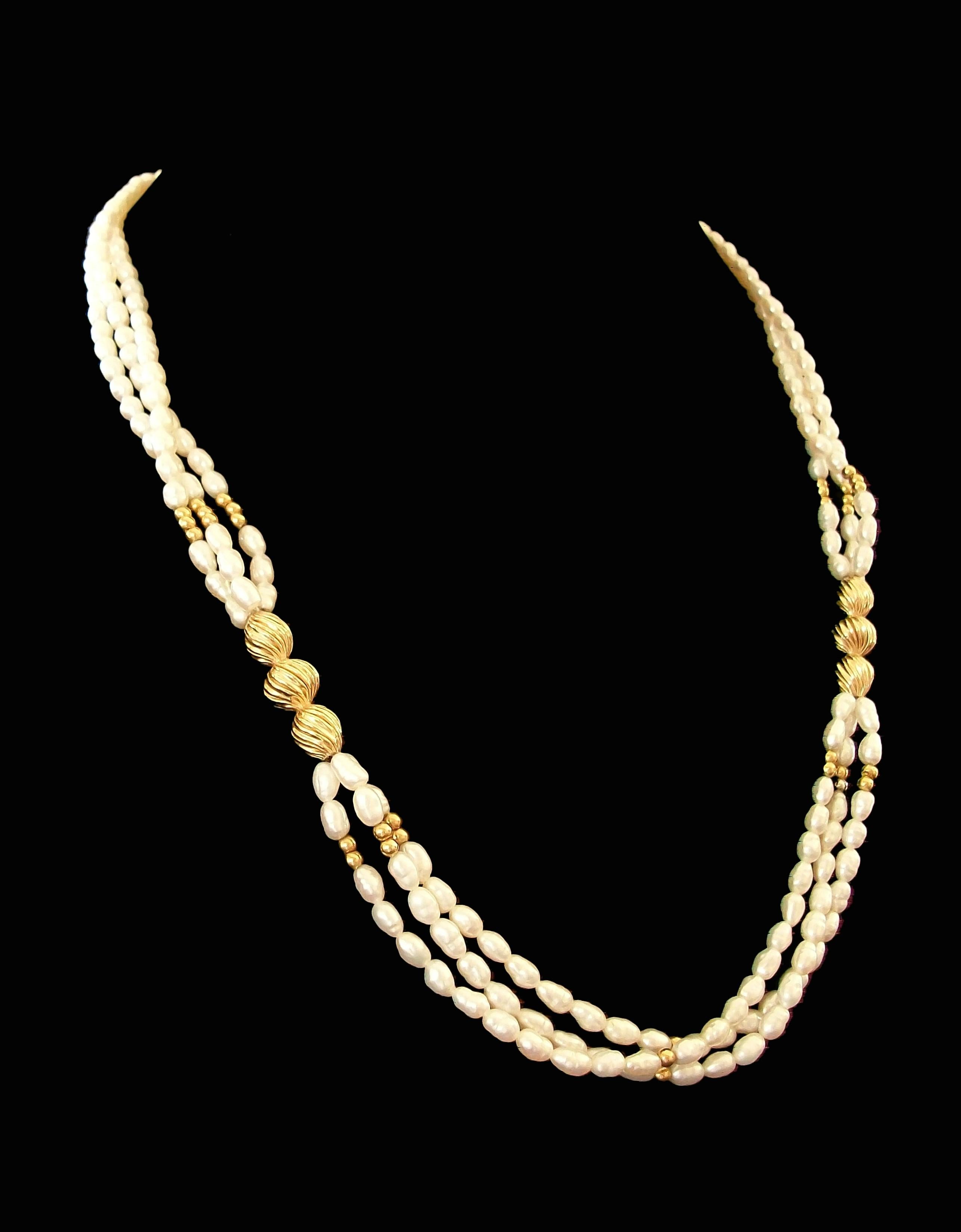 Vintage three strand cultured Keshi Baroque Pearl and 14K yellow gold necklace - fine quality and luster to the pearls - featuring two 14K gold one inch spacers with smaller gold balls throughout - gold ball and hook closure - stamped 14K on the