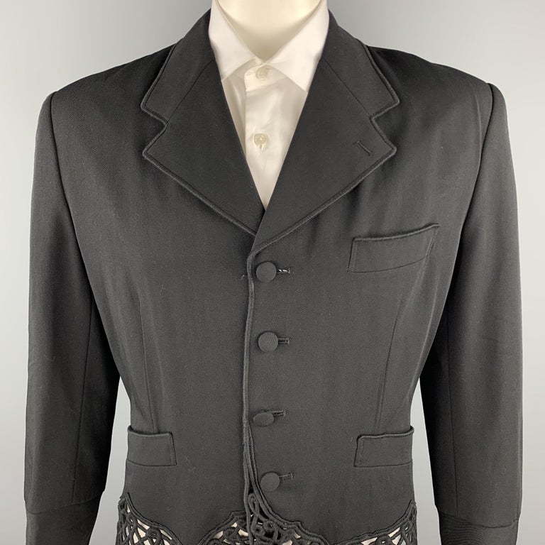 Vintage MATSUDA jacket comes in a black wool with guipure lace details featuring a cropped style, notch lapel, slit pockets, and a buttoned closure. Made in Japan.

Very Good Pre-Owned Condition.
Marked: Size not visible 

Measurements:

Shoulder: