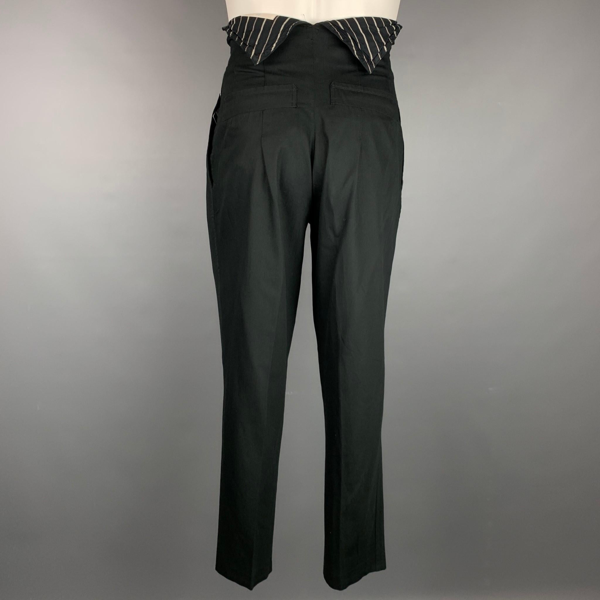 Vintage MATSUDA dress pants comes in a black wool blend featuring a high waisted style, pleated, slit pockets, and a zip fly closure. Made in Japan.

Good Pre-Owned Condition.
Marked: No size marked

Measurements:

Waist: 30 in.
Rise: 13.5