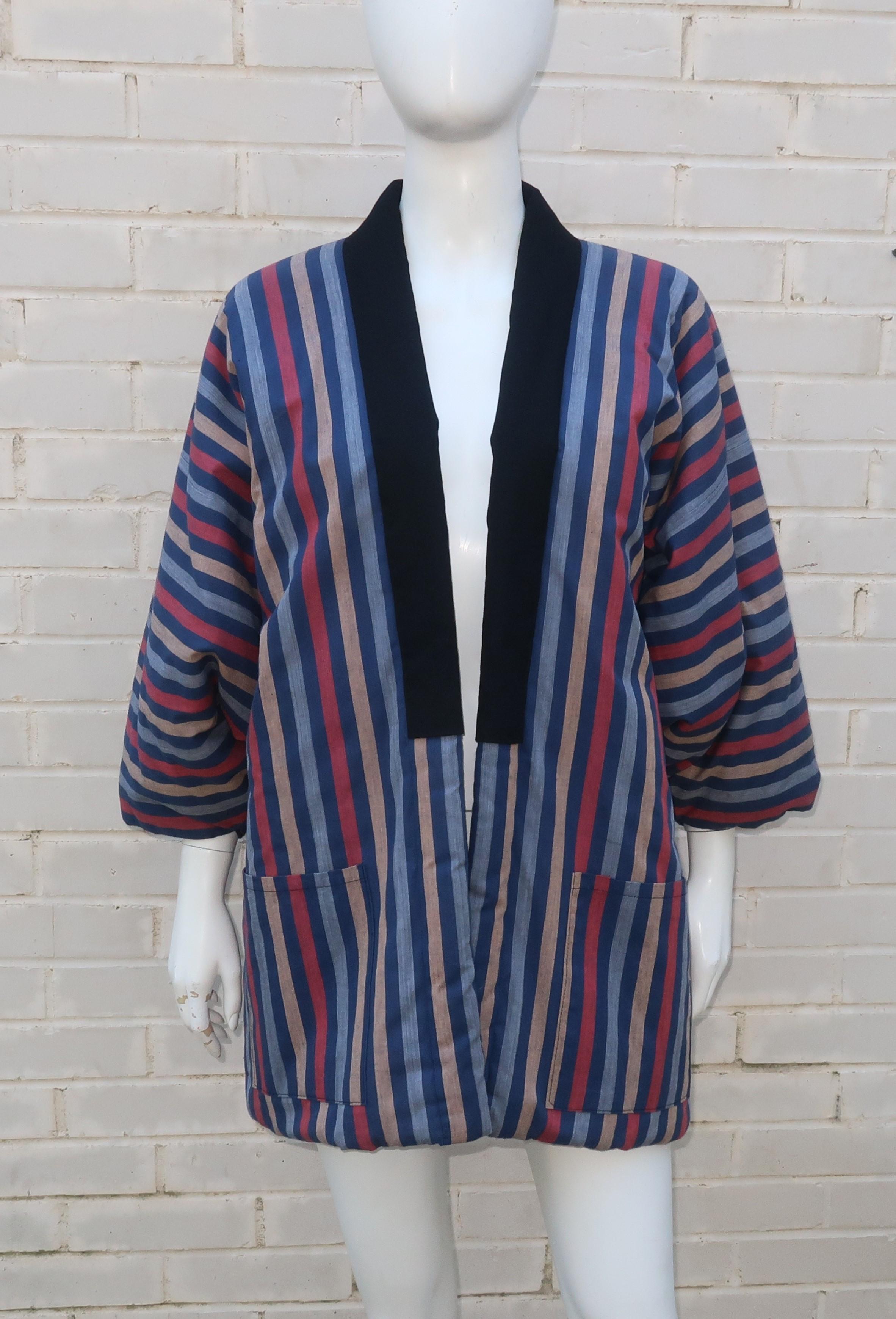 This vintage men's kimono jacket is from Matsuya, a Japanese department store which has produced kimonos since the late 1800's.  Classically cut with a black lined open front, the jacket is fabricated from a comfortable cotton striped cloth