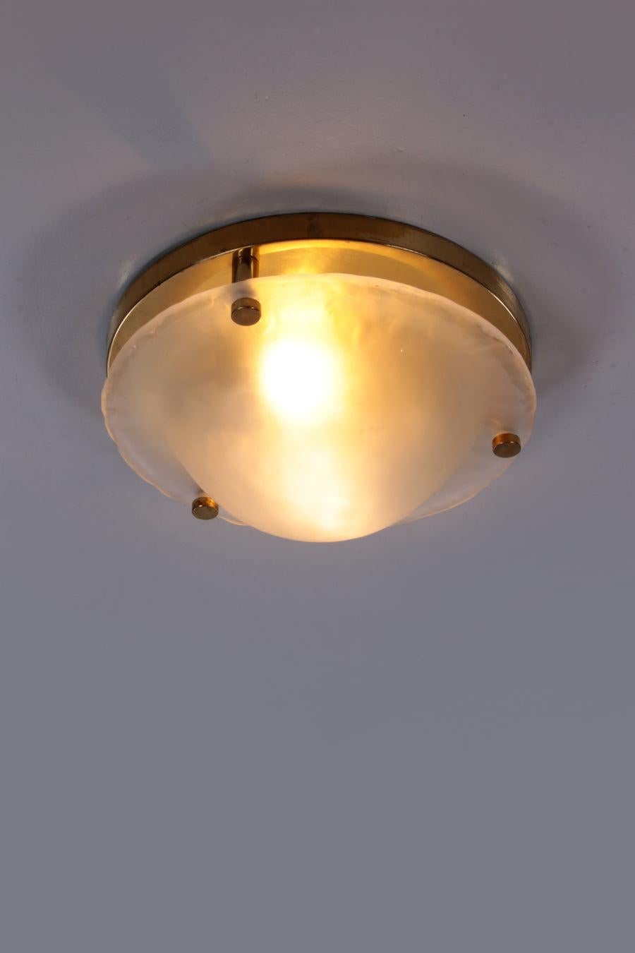 Vintage Matte Glass Ceiling Lamp by Fischer Leuchten

This is a beautiful ceiling lamp, with a brass mounting plate and brass buttons.

The glass plate is of nice thick quality and easy to attach.

Additional information:
Dimensions: 40 W x 40 D x