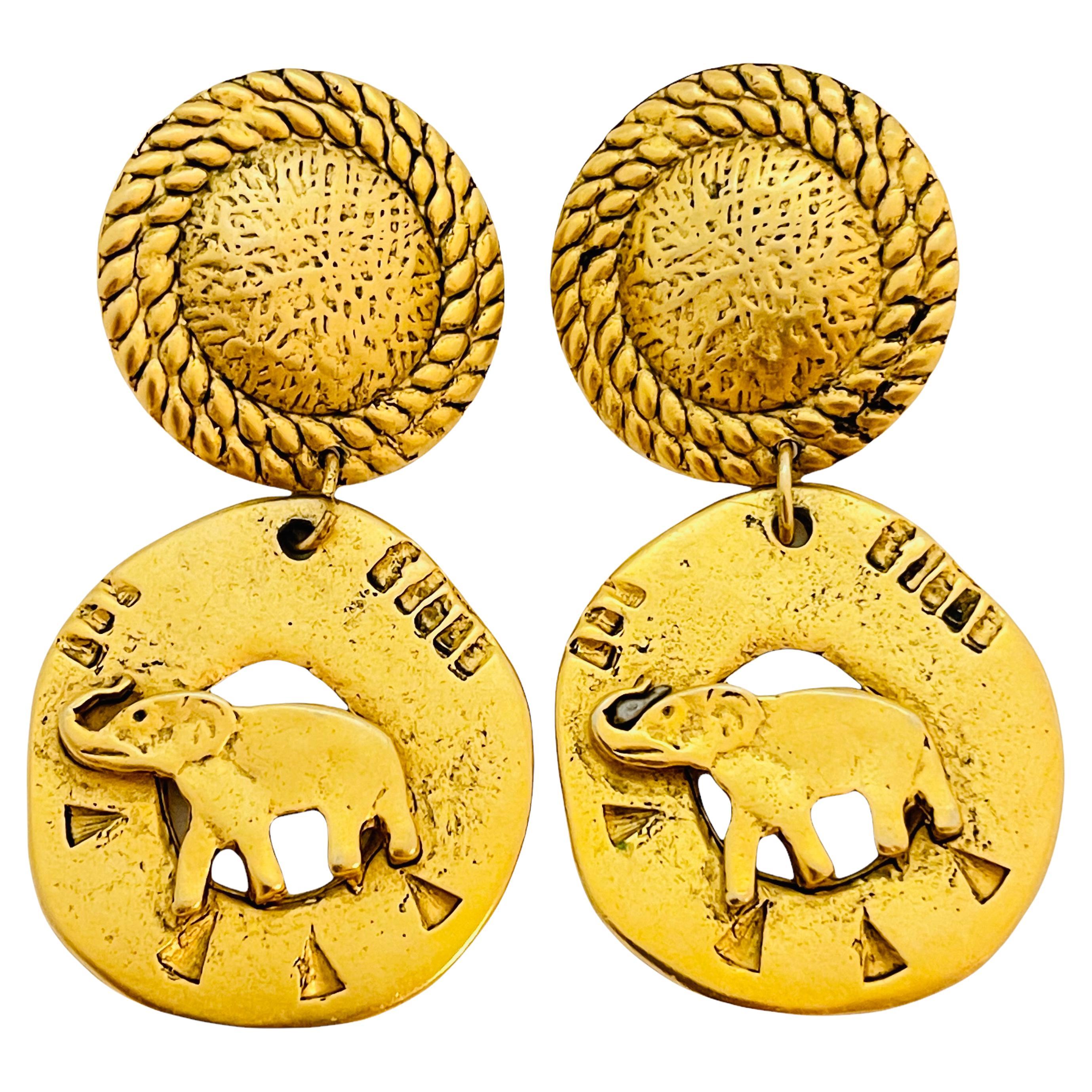 Vintage matte gold enamel dangle elephant designer runway earrings For Sale