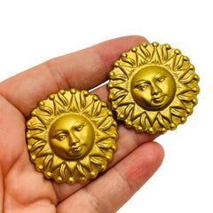 Vintage matte gold sun face pierced earrings