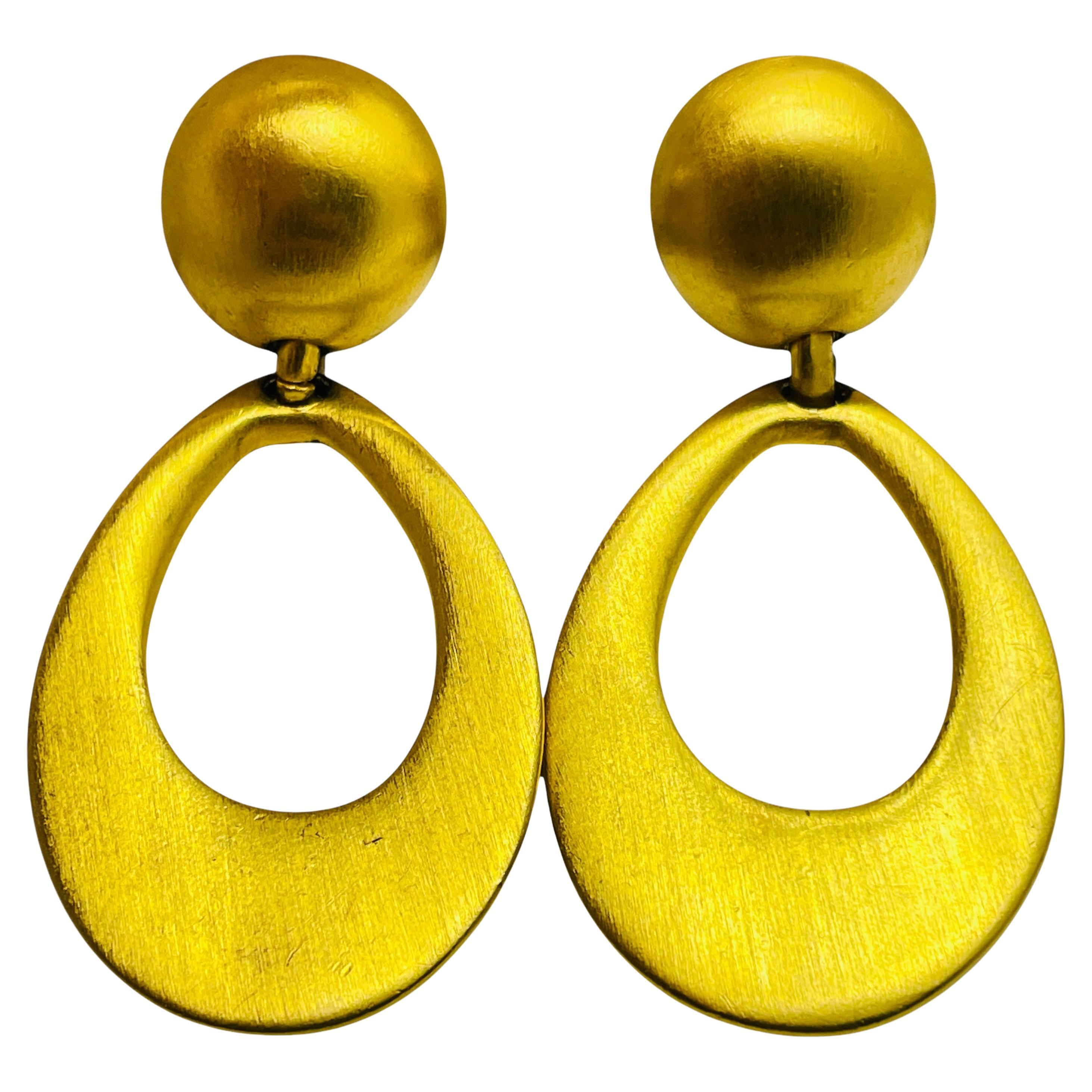 Vintage matte gold tone dangle designer runway clip on earrings For Sale