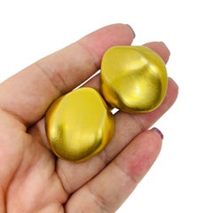 Vintage matte gold tone designer clip on earrings