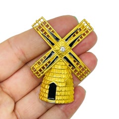Vintage matte gold tone enamel rhinestone windmill designer brooch