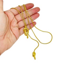 Vintage matte gold tone long snake chain knot pendant designer necklace
