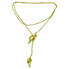 Vintage matte gold tone long snake chain knot pendant designer necklace